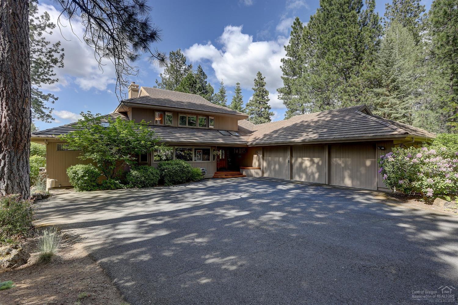 Spectacular views from the back rooms and deck and Hottub of this Glaze Meadow custom Steve Van Sant-Designed home. Black 'Butte' is the WOW and this home overlooks an open range of the 2nd and 3rd fairways of Glaze Meadow with Homestead Lake in the picture too. Sunsets from the hottub that sits off the Vaulted Main Level Master w/fireplace + enormous dressing closet and oversized Bath w/corner Jacuzzi jetted tub and steam shower w/dual heads and more! Lower level huge Utility room and family room and office. Upstairs offers 2 addl Master Suites. 3-car garage with wood storage and many other storage areas.Concrete tile roof + cedar siding and woodclad Pella windows..some being casement windows. Kitchen is loaded with custom features: Corian countertops, Island, Double Ovens & overlooks the BBQ deck and Vaulted Great Room w/stone fireplace. Custom Water Feature, Central Vac, Dual Furnaces, Dual Water Heaters & Heat Pumps. Skylights bring in the Ranch light. Comes Partially Furnished