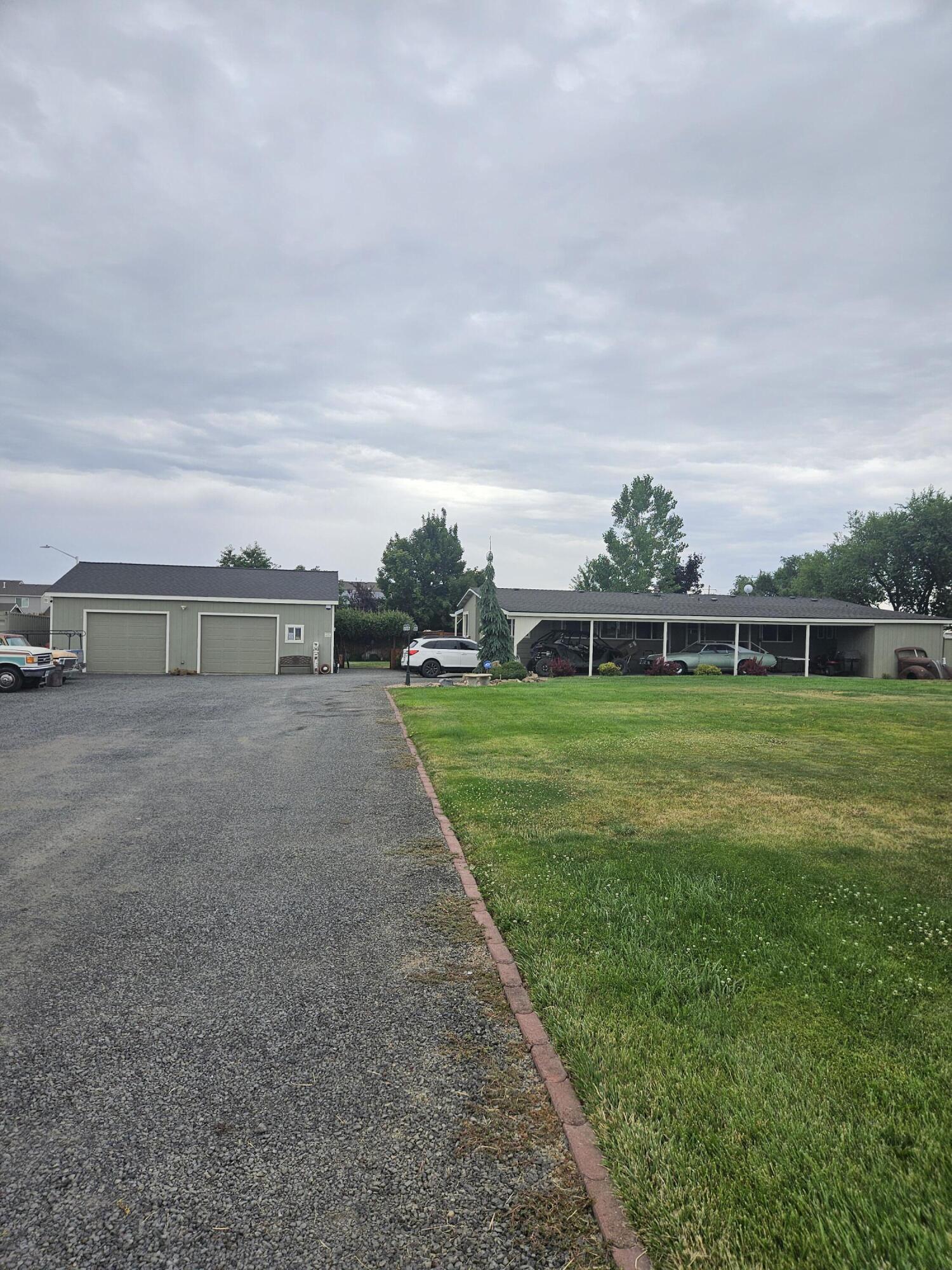 This home is perfectly modernized.  Open living, dining and kitchen.  Abundant windows for views and sunlight.  Cascade Mountain views.  Wonderful, newer 30X 40 stick built fully insulated with a cement floor and two overhead doors.  Large carport with RV hook ups.  The entire property is perfectly landscaped and ready to enjoy.  Large backyard porch.  Close to town, yet out of town.  Call your favorite agent today for a tour.