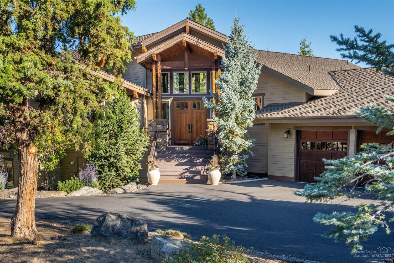 Welcome to the entertainers dream in the desirable Westside of Awbrey Butte. A builder's custom home, boasts 2 story vaulted open great room, w/ enlarged wood-wrapped windows from beautiful vistas of the mtns., romantic 2-story fireplace (w/ surround sound), with immense natural light & is extremely well insulated. Chef's kitchen with upgraded appliances leads you to the delightful & expansive patio w/ trex decking and hot tub staged outside of the elegant master suite on main floor. Custom wood floors & modern travertine tile. Dual furnaces/AC units. Something for everyone, including direct access to River Trail North. Don't miss this unique opportunity!<br>