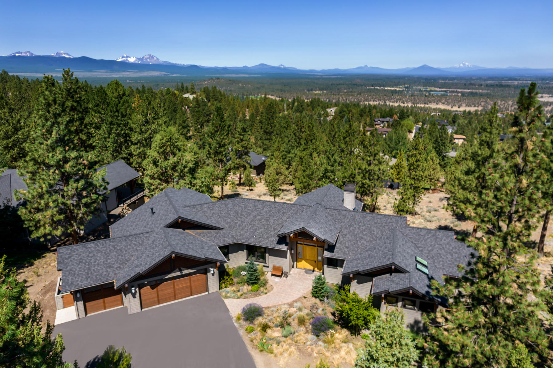 Escape to this peacefully situated single level luxury home resting on .78 Acre homesite in desirable Awbrey Butte. Northwest style custom built home by Norman Building & Design offers unparalleled craftsmanship and exceptional amenities! You'll treasure the captivating Cascade Mountain views from main rooms. Richly-appointed spaces include large great room floor plan with cathedral cedar ceilings, gourmet kitchen, plus access to large covered deck for ease of  indoor/outdoor entertaining. Spacious master suite features its own private deck, luxurious en suite and huge walk-in closet. Each bedroom has its own private bathroom. Beautiful hardwood floors throughout, large alder wood windows, wide doors, and den/office. Natural, easy-care landscaping and triple car garage. You'll appreciate the short drive to charming downtown Bend, shopping and numerous parks and recreation trails.