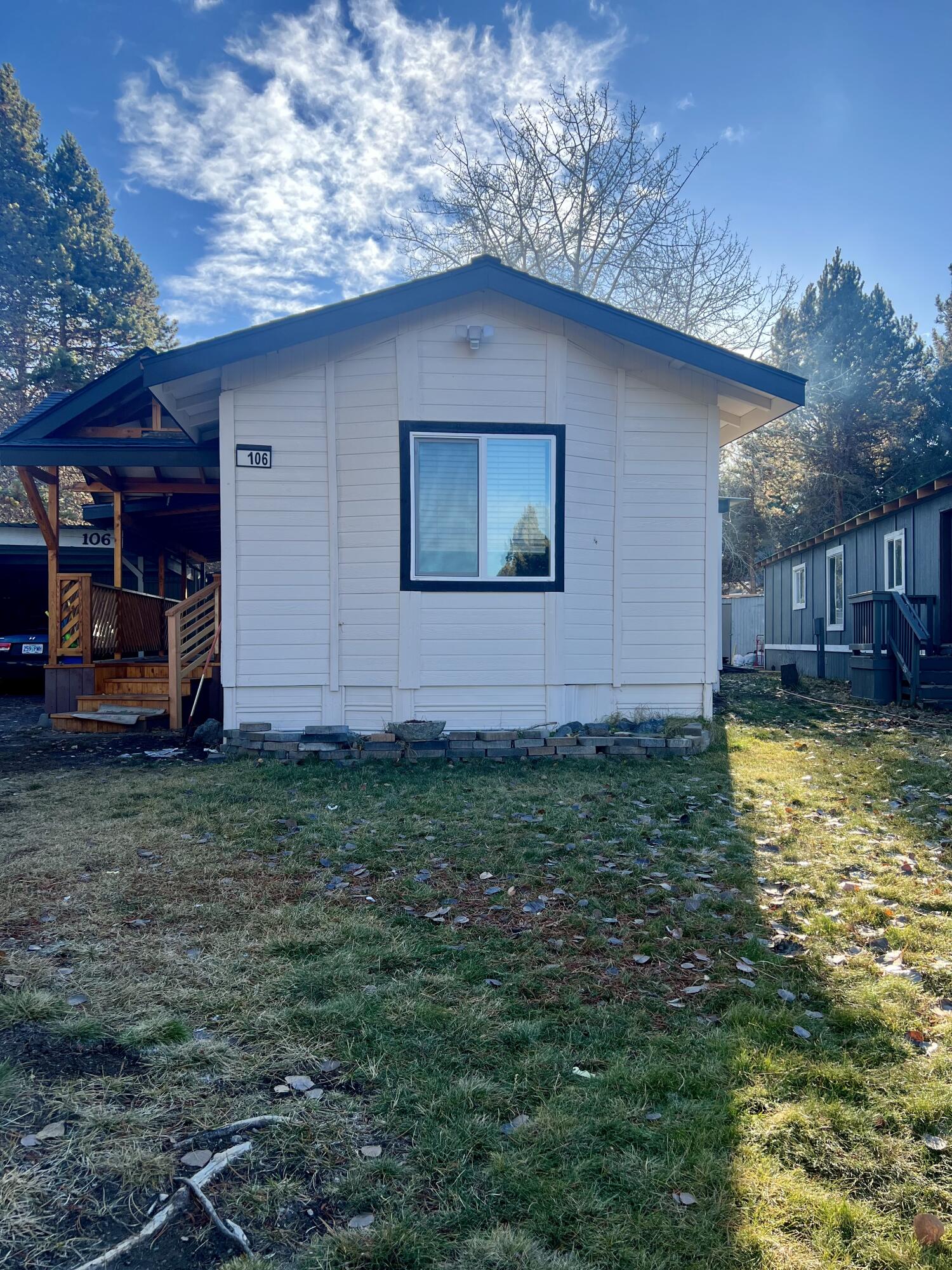 Updated affordable, bright, and contemporary Manufactured home located in country sunset park in Bend OR. With the extensive exterior renovations, serene location, and proximity to all Bend has to offer  this home offers the perfect blend of comfort and convenience. Home offers 2 Bedrooms, 2 baths and an enclosed covered patio. Laminate flooring throughout the house and updated bathrooms. Whether you are looking for a peaceful retreat or a place to entertain this home has it all, mature landscaping, large front deck, a carport which provides additional parking and a shed for additional storage. Monthly space rent includes water, sewer, street snow removal Motivated seller!!