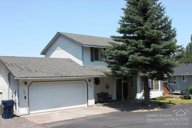 Pride of ownership shows in this lovely 3 bedroom 2.5 bath home tucked back off the street in a nice neighborhood. Hardwood floors in the kitchen and dining rooms, tile entry and nearly new carpet in living room - fireplace with gas insert. Bay windows add character, spacious deck to enjoy the outdoors. Many trees add privacy. Double attached garage and landscaped with underground sprinklers. Listing agent is related to the sellers.