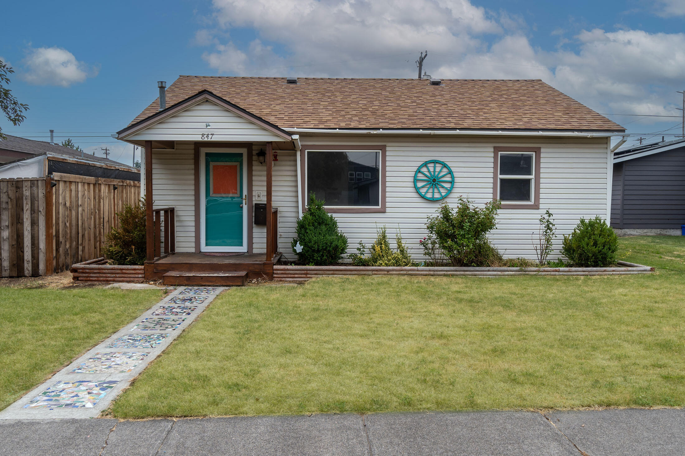 Built in 1953, this charming home located on .11 acre lot, combines vintage appeal with modern potential. 2 Bedroom/ 1 Bath, 776 sqft. with original hardwood floors, new interior paint, remodeled bathroom, new roof in 2019, fully fenced, detached garage with access to the alley. Zoned for both residential and commercial use. Close to town and local amenities, shops, schools, and restaurants, makes it an ideal location for those seeking the perfect blend of work and lifestyle.