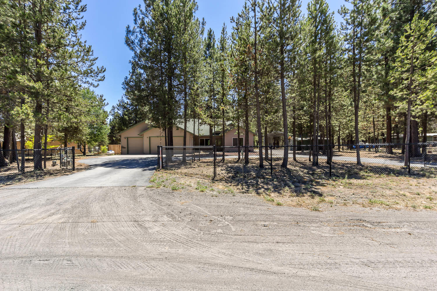 Lovingly maintained & custom built, ranch style, 4 bedroom home on an Acre in La Pine! This single level home features an open concept floor plan with elegant finishes and new appliances. Enjoy warm toned wood laminate flooring, gas fireplace and tiled hearth, new interior paint and beautiful vaulted ceilings to compliment your Central Oregon décor. The spacious primary suite is located on one side of home for privacy and separation from 3 more bedrooms located at the other end of the home. Open kitchen with plenty of bar seating with adjoining dining area. This oasis is complete with 3-car garage, paved circular drive, groomed outdoor spaces, covered patios, pergola, RV shelter, firepit, animal corral, small shop with metal roof and extra parking. All in a very private setting, tucked away on a quiet road and fully gated with 2 entrances.  A/C & gas fireplace. Maintenance contract for furnace included.