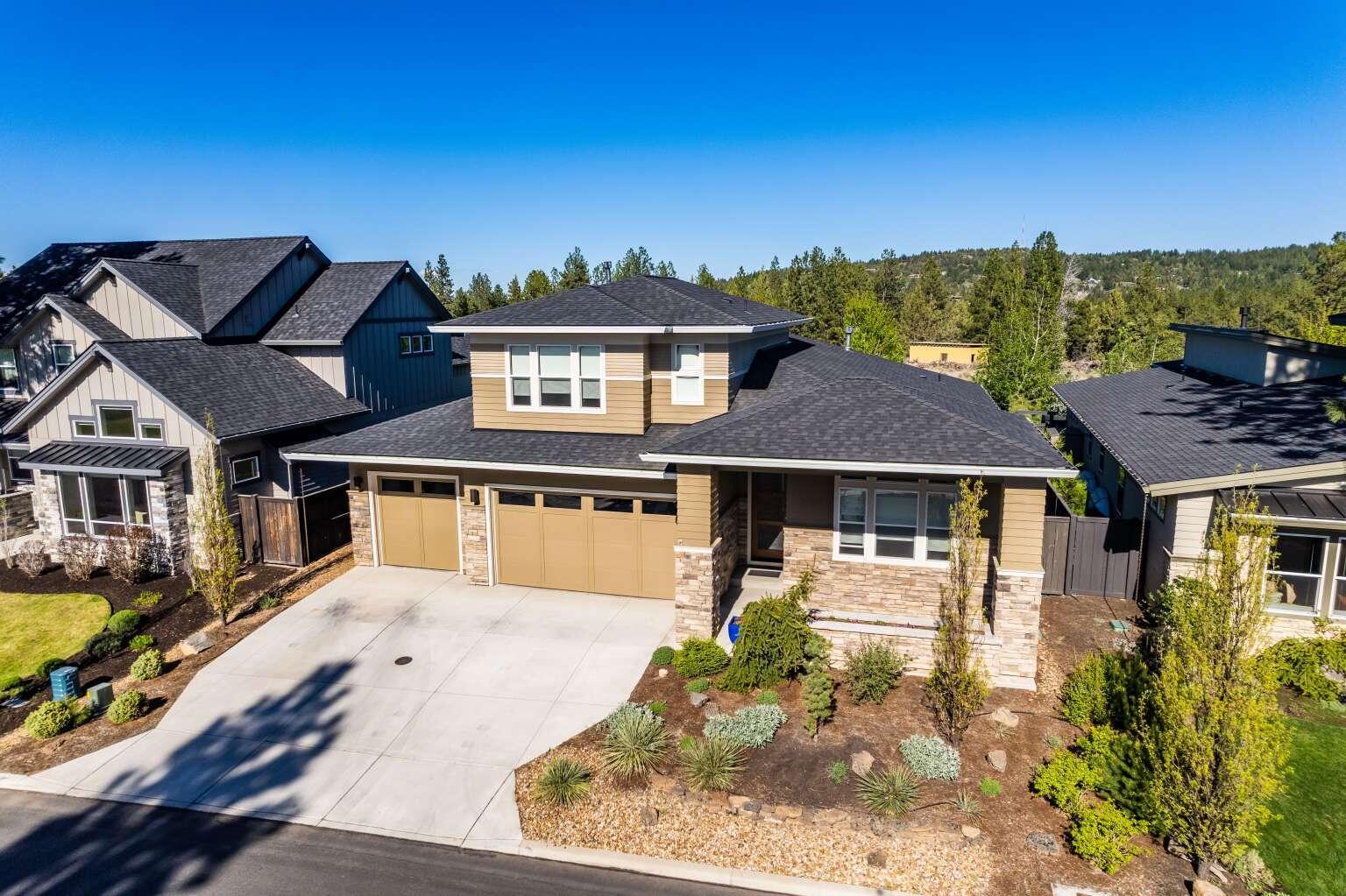What a floorplan! Beautiful, light, bright and airy home on dead end cul-de-sac street, orientation provides morning sun all year. Completely open floor plan with 11' ceilings in main area, multiple tall windows on all sides. This 4 bedroom 3 bath home has a large first floor main bedroom suite with oversized shower and separate soaking tub. Two additional first floor bedrooms all with 9-11'' ceilings and second full bath. You will love the open gourmet kitchen, 11' island, two dishwashers & wine fridge. Upstairs a large loft for relaxing with 4th bedroom and large full bath, a separate suite unto itself. Light hardwoods on mail level, built ins and quartz counters through out. If you love to entertain you will love this home, inside or out the oversized covered/open patio, landscaping & gas firepit area makes for intimate relaxing after dinner gatherings. Close to K-12, Summit HS and NW Crossing. 3 car garage. Walk to Shevlin Park. Private fenced beautifully landscaped yard!
