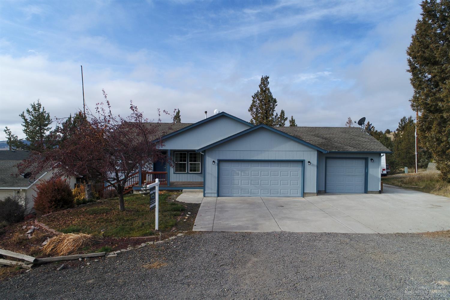 Enjoy views of the valley, Cascade Mtns, Grizzly & the Ochocos from this cozy hill top home. Great room design w/comfortable space for entertaining the family this holiday season. Open kitchen offers plenty of storage & working space, adjacent dining area is spacious enough for lg & hutch or buffet. Living area extends onto massive deck that looks over the above ground pool & to the western Cascades. Private Master Ste w/french doors to the private hot tub area & deck. 2 additional guest rooms & full bath. Rare triple car garage & RV parking too! Daylight basement could be finished for additional den, storage space or a fantastic wine cellar or brewing area. Located in NW Prineville in a quiet community w/plenty of opportunity for adventure - miles of trails, fishing pond, stables, clubhouse & pool & the mountains as your back drop. Just painted, pool winterized & ready to go - don't miss!Seller will remove pool upon request.<br>