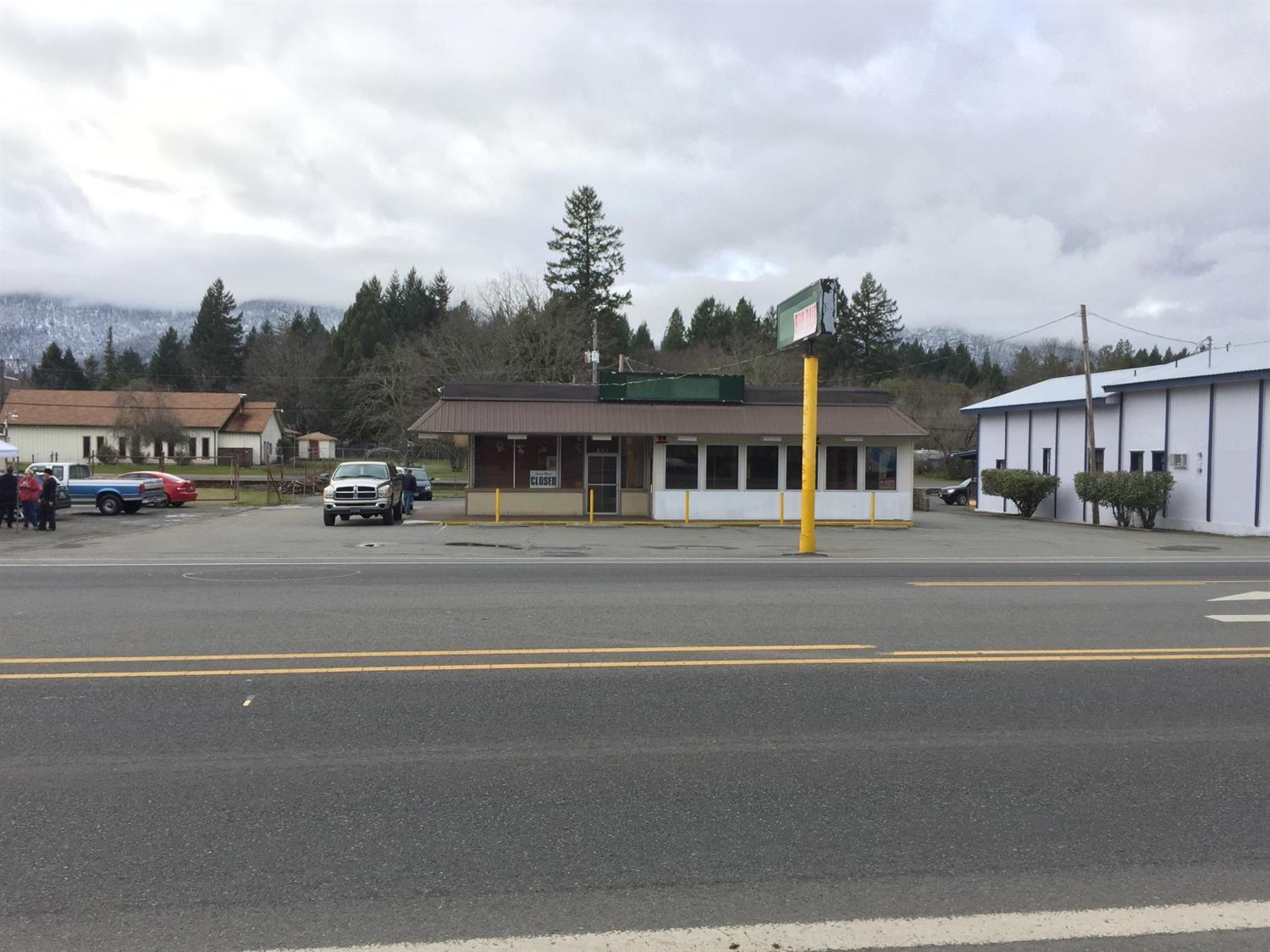Great Location right on Redwood Hwy in the busy town of Cave Junction. Drive by Traffic counts are in the millions a year. Travelers from California to Oregon and Travelers in Oregon heading to the coast.This is a scenic route to the Oregon Caves and the Redwood Forest. This location has so much potential for a restaurant or just about anything retail you can imagine. New stores are moving to Cave Junction, recent newest Grocery Outlet opened late 2018. This town is growing and commercial space like this will not be available at this price as the town gets bigger, especially right off Redwood Highway. Come take a look and imagine all the possibilities. Large .34 Acre Commercial Lot. The Seller is seeking a qualified buyer to take over this location and put up your Open For Business sign. All information deemed accurate, Buyer to perform their own due diligence.
