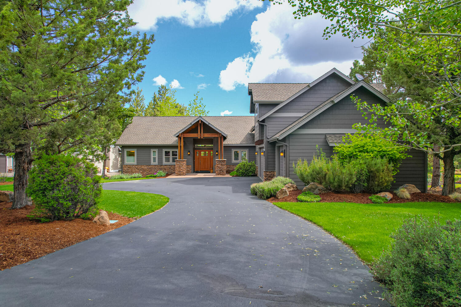 Timeless, NW Style home on .49 acre lot, backing to the 3rd hole of Rivers Edge Golf Course. This 3076 sq ft home was thoughtfully built. Main level living, with all bedrooms and office on the first level, and large bonus room with full bath up. Primary is nicely separated from the guest rooms, and offers a large soaking tub, walk-in tile shower, and walk-in closet. Each bedroom is an ensuite with private access to the back deck. The bedroom/bonus room configuration would nicely accommodate multi-generational living. Virtually no wasted space, and the amount of storage is incredible. Main level offers hardwood flooring, and one year new carpet on the stairs and in the bonus.  Slab granite in kitchen, tiled tops and floors in bathrooms plus tiled showers.  Extras and upgrades include closet organizers, central vacuum system, sink in garage, hot tub disconnect, gutters, rock accents on front of home, and true triple garage. Come make your own memories in this beautiful home.