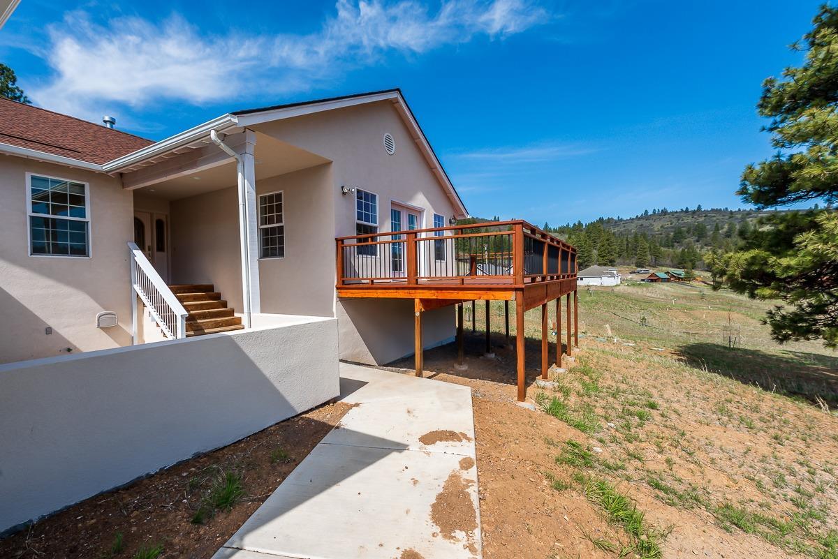 2.37 acres with a beautiful mountain view. This 3 bedroom, 3 full bath home features; a large kitchen, bonus room in the lower level with a full bathroom and wet bar, master suite and bath with a Jacuzzi tub and an abundance of windows to enjoy the view. Brand new eco friendly septic system, roof and a wrap around deck.