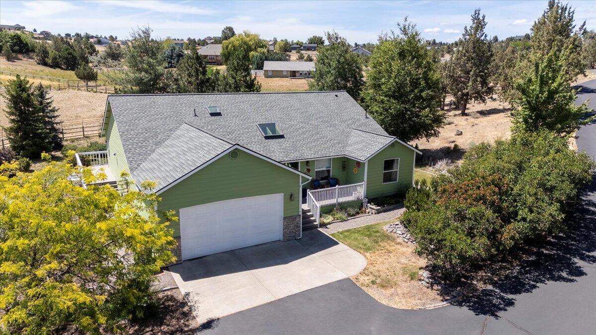 This well-maintained home sits on 2 level acres, fully fenced and ready for animals, gardening, or play. Inside, enjoy a spacious open floor plan with excellent separation of the primary bedroom. The kitchen offers solid-surface counters, abundant workspace, and flows easily into the living and dining areas—perfect for everyday comfort or entertaining. Major updates include a 2-year-old roof with skylights, a new heat pump in 2023, a 3-year-old hot water tank, and fresh exterior paint in 2024.
Extras you'll love: whole-house sound system, central vacuum with new hose/attachments, and a 4-year-old hot tub to unwind under the stars. Outside, there's plenty of parking—including RV power hookup—a finished shed with permitted electrical, plus an added garden shed with riding mower that could stay. A true gem offering peaceful rural living with modern updates already done!