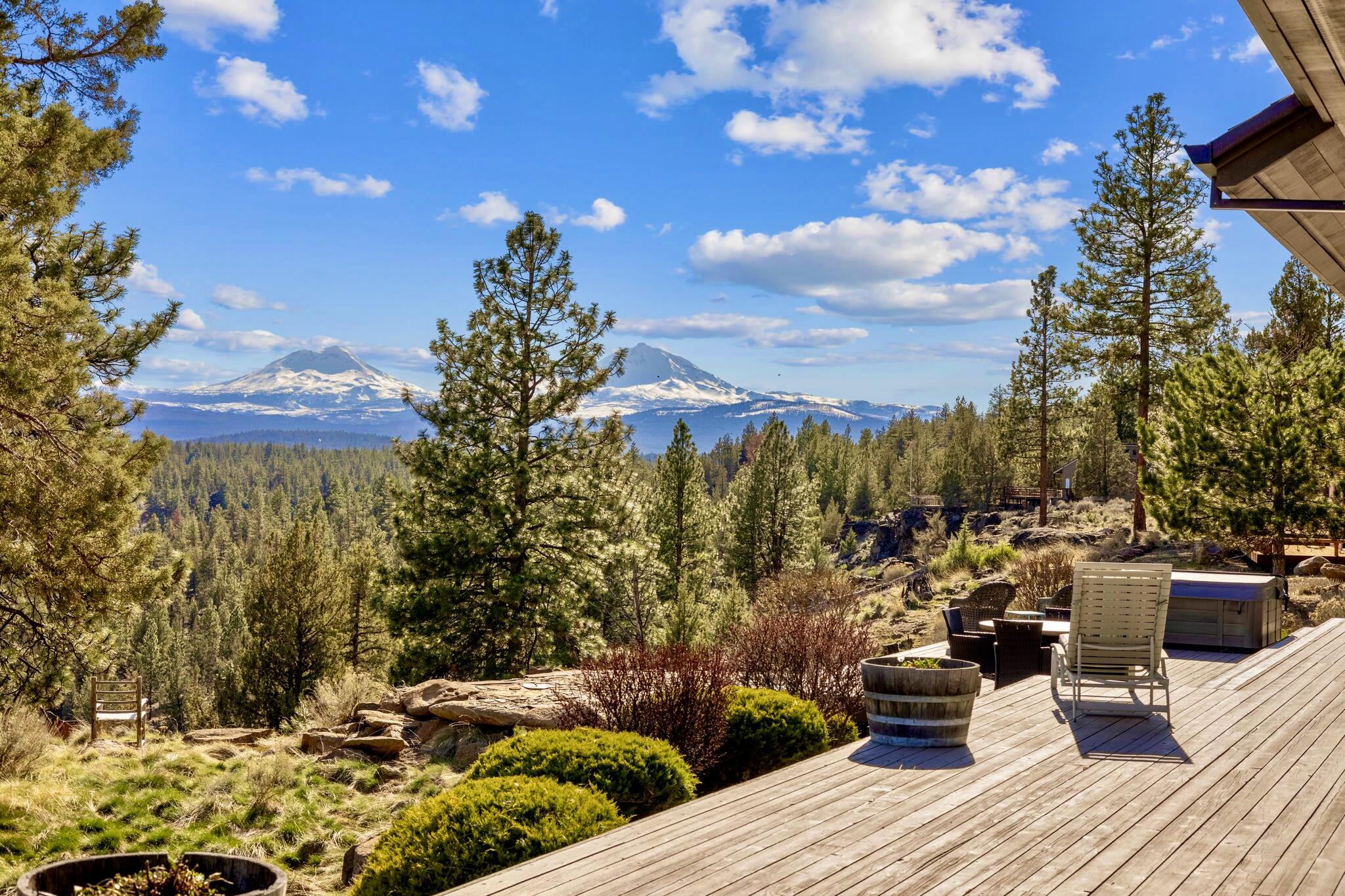 HUGE Cascade Mountain, canyon & creek views from this high-quality, custom designed & built single-level home. Interior features: Open floor plan; Two en suites with great separation & direct access to back decks; Extra high ceilings; Extensive run of skylights in great room; Large windows/doors providing abundance of natural light; Clear cedar ceilings in high areas; Custom Mahogany cabinetry & built-ins; Eucalyptus flooring; Granite countertops; Large gourmet/kitchen with stainless appliances, huge island, built in wine cooler/bottle storage; Large primary bedroom with great windows/high ceiling/fireplace/walk-in tile shower/closets/double vanity/jetted tub; 8' Douglas Fir doors & wood framed windows. Exterior features: Large covered front & back porch; 3 car garage with extra width/depth; Full attic storage; Additional 2 car garage/shop; Large paved driveway; RV parking with complete sewer, power, water hookups; Copper front door & gutters; Recirculating Hot Water; Canyon access.