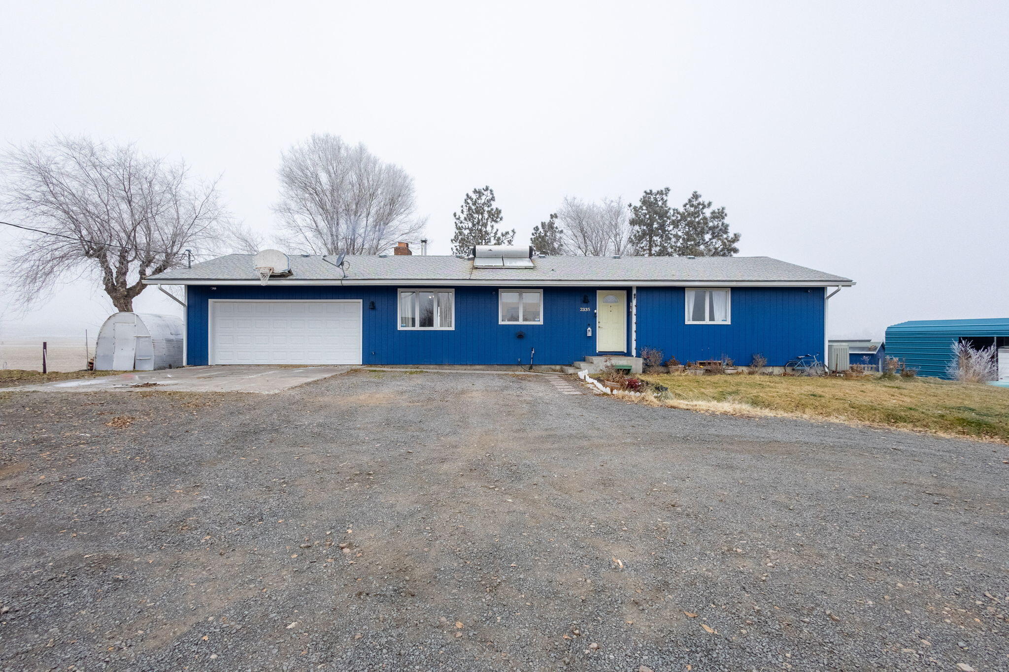 Amazing Cascade Mountain views! Spectacular sun rises and sun sets! This home has it all. Rural yet close to town, and surrounded by farms. Water rights and a fenced pasture. Open living, dining and kitchen. Large primary with walk in closet. Great family room and another hobby/storage room. Completely remodeled inside! New paint outside! Brand new back deck. 3 carports and 2 sheds. RV cover. Tons of storage! New 20' x 50' greenhouse to grow your own veggies! This home has room to spread out. Great mature trees and yard. Fenced back yard, ready to enjoy the outdoor living. Dead end road for privacy.