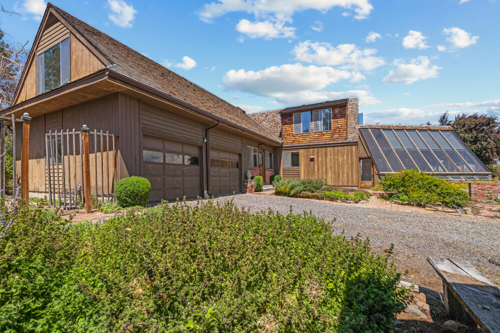 A Private Oasis with Unmatched Views Just Minutes From Downtown — First Time on the Market!

Nestled on nearly 8 acres offering panoramic views of Klamath Falls and Lake Ewauna, this timeless estate offers a rare opportunity to own a piece of paradise. Spanning 2,370 sq ft, the 4-bedroom, plus an office/ bonus room, 2-bath residence is steeped in vintage charm and character, lovingly preserved and ready to inspire.


Wander through meandering brick paths to a flourishing rose garden, or unwind in the attached active and passive solar-heated greenhouse — a year-round sanctuary for plant lovers. The expansive workshop is ideal for the craftsman or potentially a dream guest house.


This enchanting property seamlessly blends privacy, serenity, and convenience — all just minutes from downtown shopping and dining!
Don't miss your chance to own this once-in-a-lifetime legacy property!