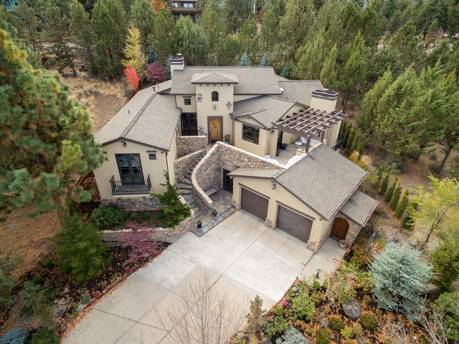 A wonderful first impression that won't disappoint! Grand entry, luxury living, expansive tiled floors, 8 Sets French Doors &  outdoor entertaining w/ fireplace & bbq access. This Awbrey Park gem lives like a single story with the benefit of a lower level for guests or hobbies. Two master suites on the top floor are separated by the great room that boasts a floor-to-ceiling fireplace which can be modern or traditional depending upon your vision. The chefs kitchen with Dacor appliances, granite counter tops and views that make you want to stay a while. Downstairs is on a separate heating zone w/ a lovely guest suite & a private patio overlooking the city for amazing evening views. A large bonus room & flex rooms to suit all your needs. The game room would make a wonderful wine cellar or kitchenette! An additional 780 SF of semi-finished storage. Beautiful gardens surround the home, boasting a bevy of trees & shrubbery to create a back yard oasis- no matter the season!