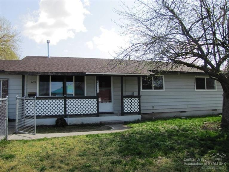Lots of potential in this cute, single-level home on a corner lot! Features 4 bedrooms and 2 baths, wood floors, living room, dining area, and spacious kitchen with new appliances and breakfast bar. New interior paint and carpeting. Situated on a good sized lot with large drive through gate in backyard to access 864 sf shop w/roll up door. Mature apple tree in the front yard. Don't miss this one! This is a Fannie Mae Homepath property.