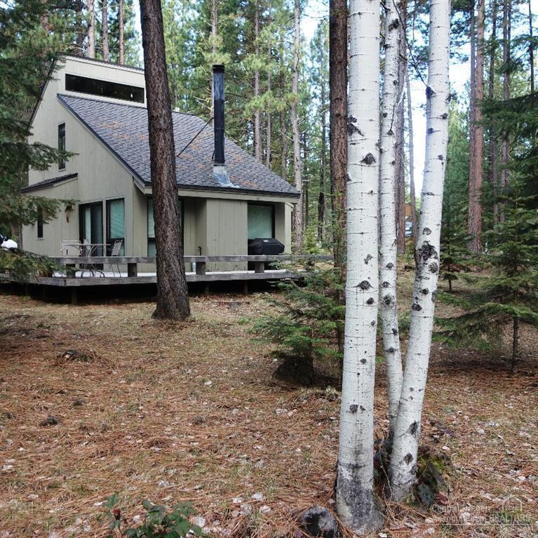 Located at desirable Black Butte Ranch. Come see this beautiful & private, wooded .40 acre lot with a much loved & well maintained cozy cabin. Build your Ranch memories while being warmed by the stone fireplace in the Great Room. Open floor plan with lots of windows making it light & bright. Lives large. Darling 240 SF master bedroom on 2nd floor, with 2 bedrooms & bath down. Easy access for the disabled. Lovely deck off living, dining,& kitchen provides ample room for entertaining. 1 Year Home Warranty.