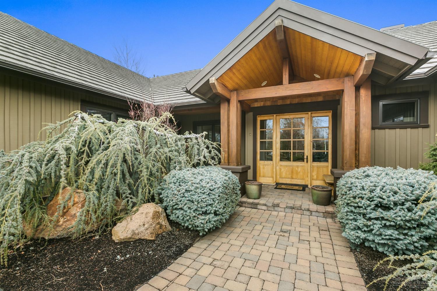 Experience luxury living in one of Bends most desirable golf communities. This single level French Country inspired home sits perfectly on Broken Tops 12th fairway. The kitchen is the heart of the home which opens to the living area, framed with floor to ceiling windows creating a light and bright home while providing spectacular views of the golf course. You will find a spacious master suite, two large guest bedrooms and a large office with lots of built ins.