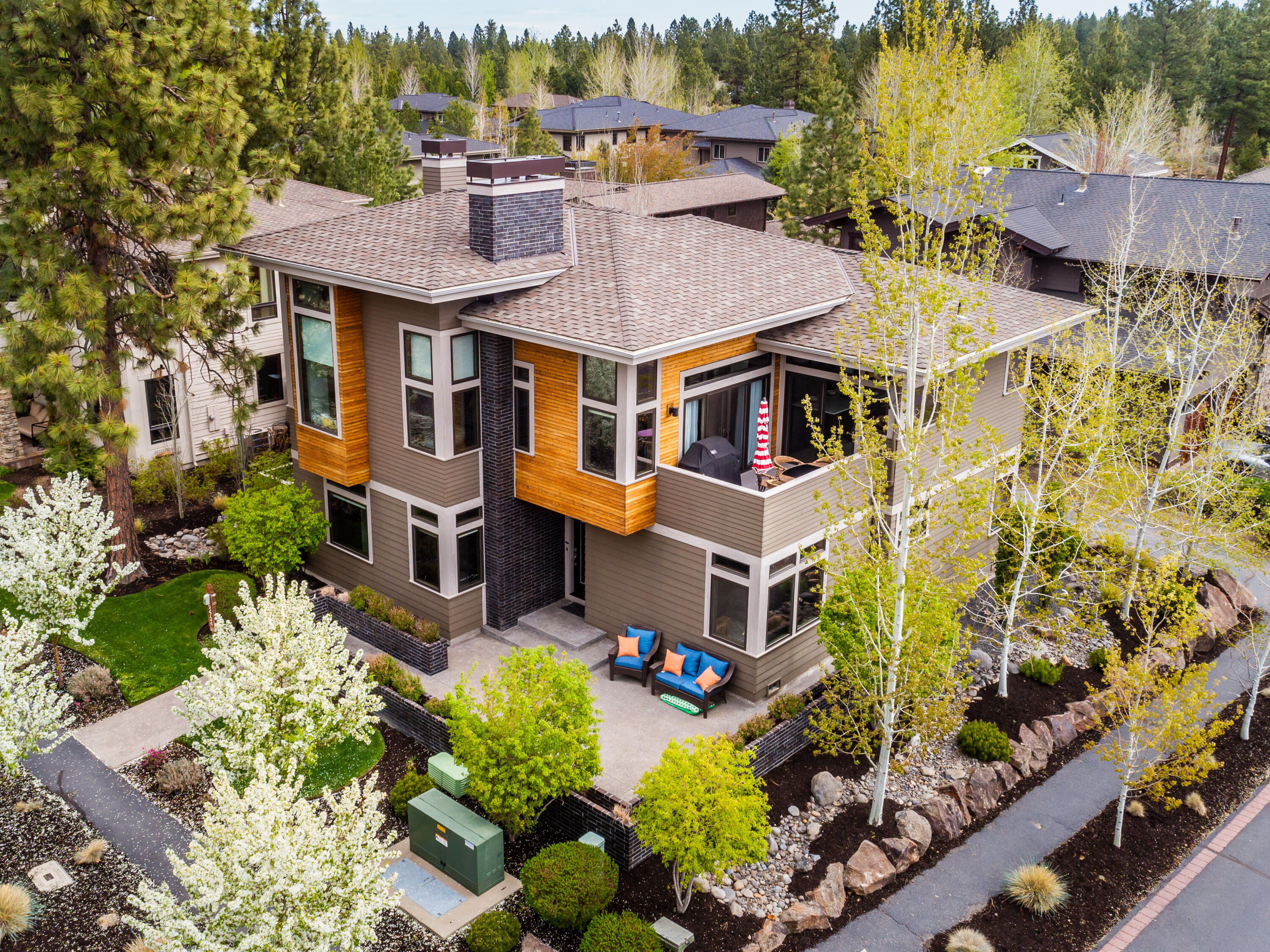 Beautifully appointed custom and modern home in Three Pines. You will enjoy looking out onto the mountains and private views from this thoughtfully and lovingly designed reverse living home. It features an expansive and open floorplan with everything a family is looking for. Large chef's kitchen, with a ton of natural light, large island bar for entertaining and open to the living and dining rooms all featuring expansive views of the trees, open space, mountains, etc. The master bedroom is loaded with his and her walk-in closets, soaking tub, large walk in shower and views. Downstairs has a nice living/bonus room with 2 bedrooms, a full bathroom, utility/laundry room and access to the garage. An office is also part of this thoughtfully designed home. Just steps away from the Shevlin Park trails and all of the westside amenities, this home is the perfect blend of retreat, home, fun, convenient, neighborly and private!