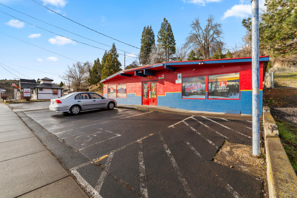 Immediate cash flow & strong potential ROI on these 2 productive commercial properties! Primely located, both properties are currently on month-to-month leases w/tenants looking to stay—1414 Oregon Ave. updated in 2024. Currently houses Oregon Lotto w/limited menu operation. The building's design boasts split floorplan & centralized cashier/flex space. Each side features a bathroom, one being ADA. 1402 Oregon Ave's convenient drive-thru service window offers added value & enhances customer accessibility/tenant appeal. Built in 2003, the 336 sq ft building has water + electric & is currently a bistro & previously a successful BBQ shack. The space is well appointed including separate cooking/washing/prepping areas & ADA bathroom. Sale also includes separate on-site storage building, essential for storing operational supplies. Established tenants, high-visibility frontage & flexible layouts make this dual-property package an outstanding opportunity for investors.