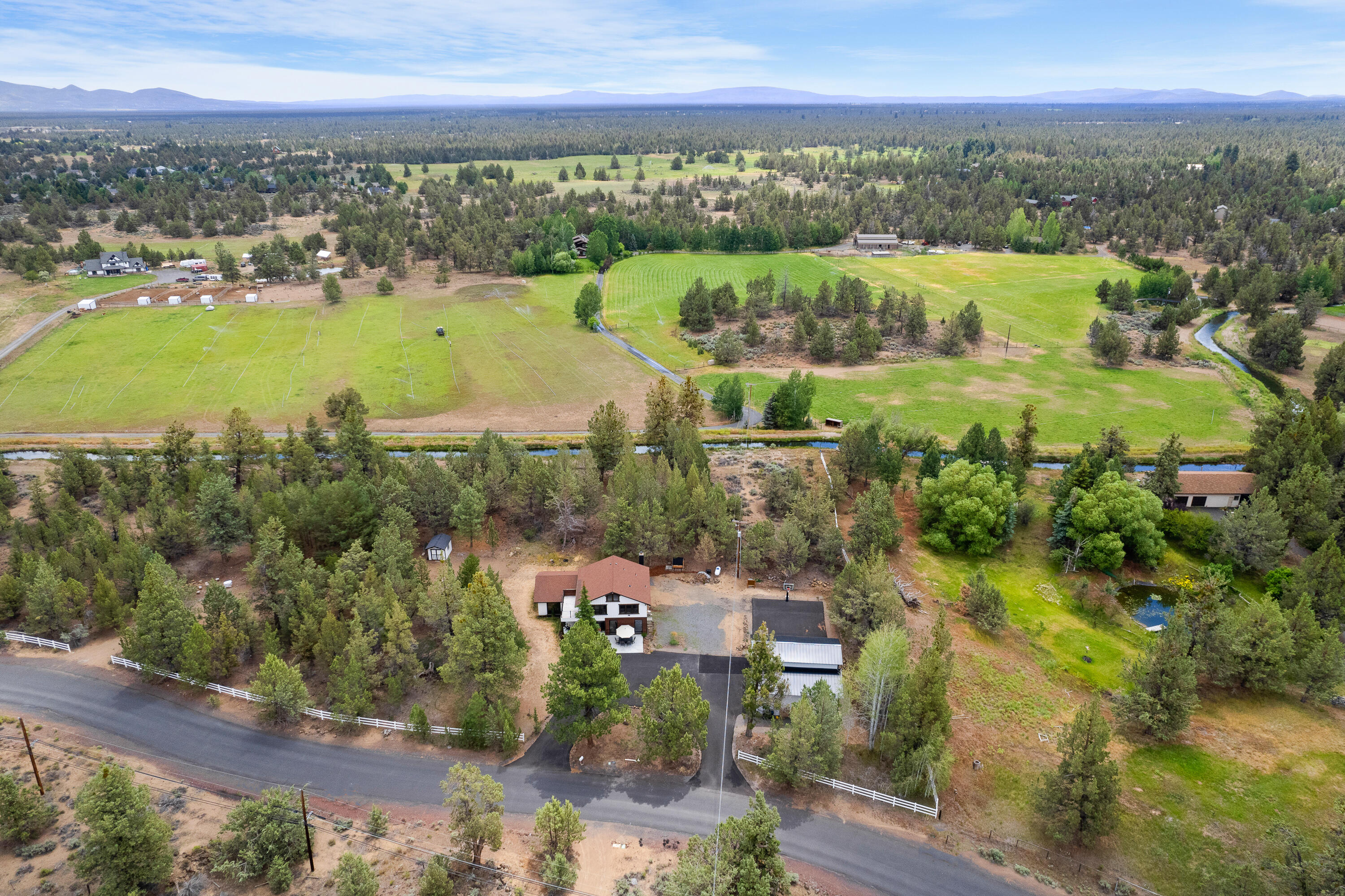 Don't miss out on this remodeled home just 15 minutes from downtown Bend. The location is quiet and peaceful. Home features a nice flowing open floor plan with primary on the main level. Real wood-burning fireplace in the primary bedroom (piped for propane conversion) Laundry connections on both floors. 3 bedrooms upstairs with high ceilings. One bedroom includes access to a balcony. Includes water rights for 2 acres of Swalley irrigation. Home fully remodeled in 2019. The new detached garage was built in 2020 for all your central Oregon toys. Don't miss out on this one!