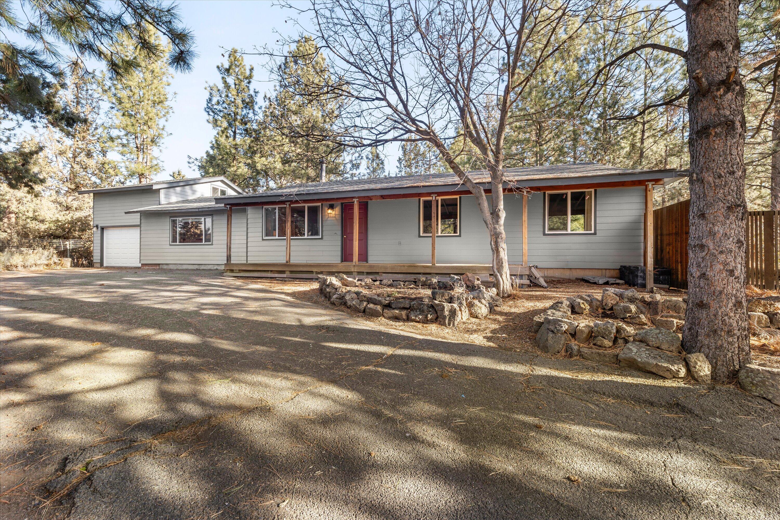 Charming Home on .74 Acres in Central Bend, OR
Discover the perfect blend of privacy and convenience with this inviting 3-bedroom, 2-bath home nestled on a spacious .74-acre lot in the heart of Bend. Surrounded by mature trees, the wooded yard offers a serene retreat while still being close to all the amenities of town.
Step inside to find a layout designed for comfortable living. The home features three well-sized bedrooms, two full bathrooms, and two large living spaces. Enjoy the peaceful outdoor setting with room to garden, entertain, or simply relax under the canopy of trees. 
Located in a central neighborhood, you'll have easy access to shopping, dining, schools, and Bend's renowned outdoor recreation. This property combines the best of both worlds—space and tranquility with a prime location.