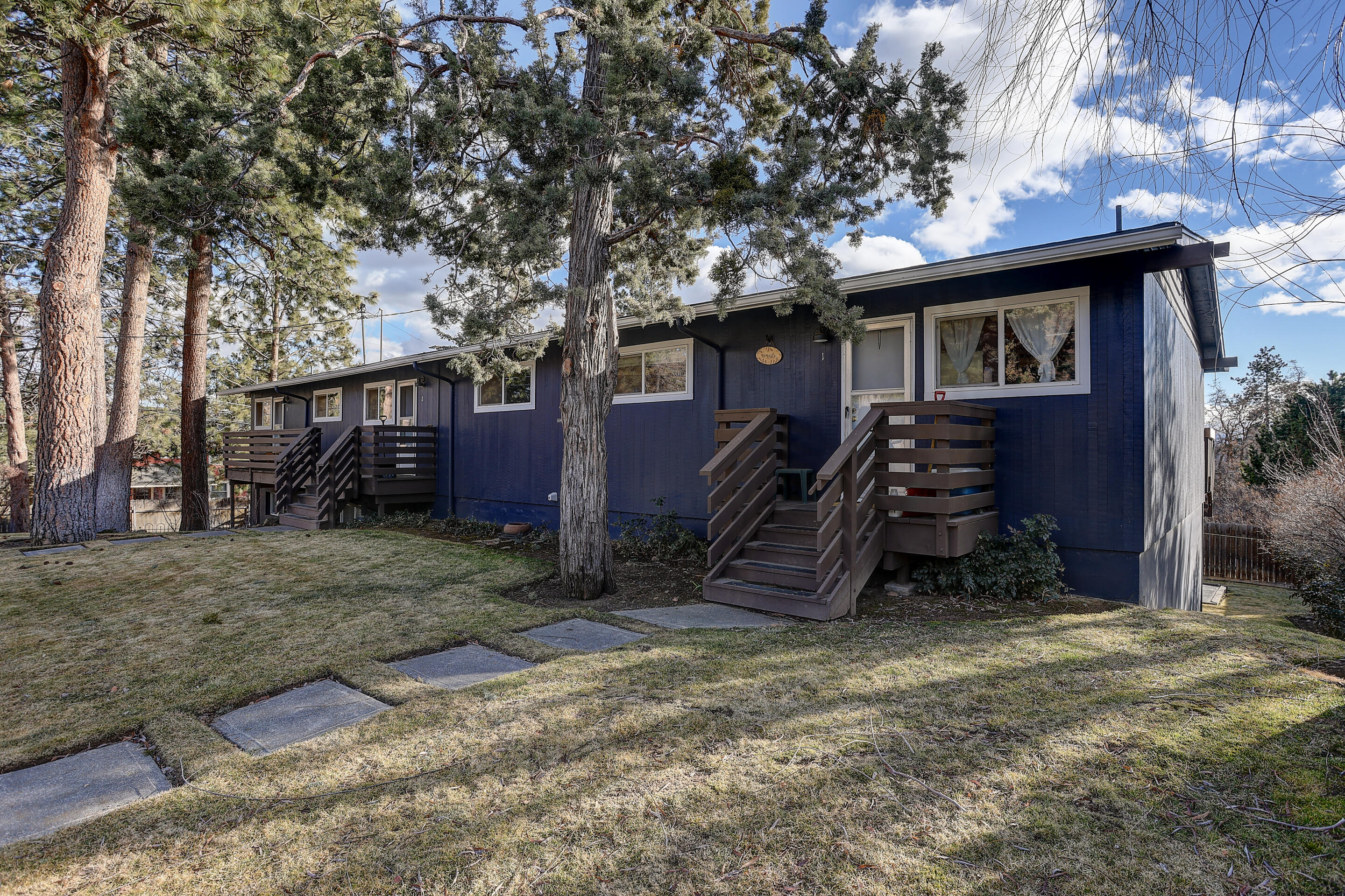 Reduced Price! This Westside 4-Plex sits perched up just high enough for Cascade Mountain and City Views from the decks of the 3 upper level units. Down below you will find the 4th unit that has access to it's own fenced in yard and patio area. All units are 2 bedroom, 1 bath with open concept living, dining & kitchen areas. Unit 4 has it's own in-unit W/D, fresh interior paint and new carpet. Units 1-3 have shared on-site laundry facility. Each Unit has a storage closet in the garage. Excellent location, close to coffee shops, restaurants, parks and more.
