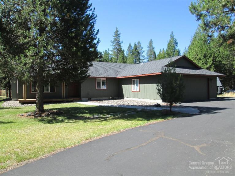 Great Contemporary Home on Paved Road in a very desirable neighborhood, just blocks from the Little Deschutes River on North end of La Pine. Property features a 1.11 acre lot w/beautifully maintained home, 3 beds, 2 baths, 1698 SF w/vaulted ceilings thru-out great room, dining & kitchen. Kitchen well set up w/center island, gas stove, pantry & plenty of storage. Attached 2 car oversized garage & additional 12x16 storage building, country front porch & great back patio area. Call today for a private showing!