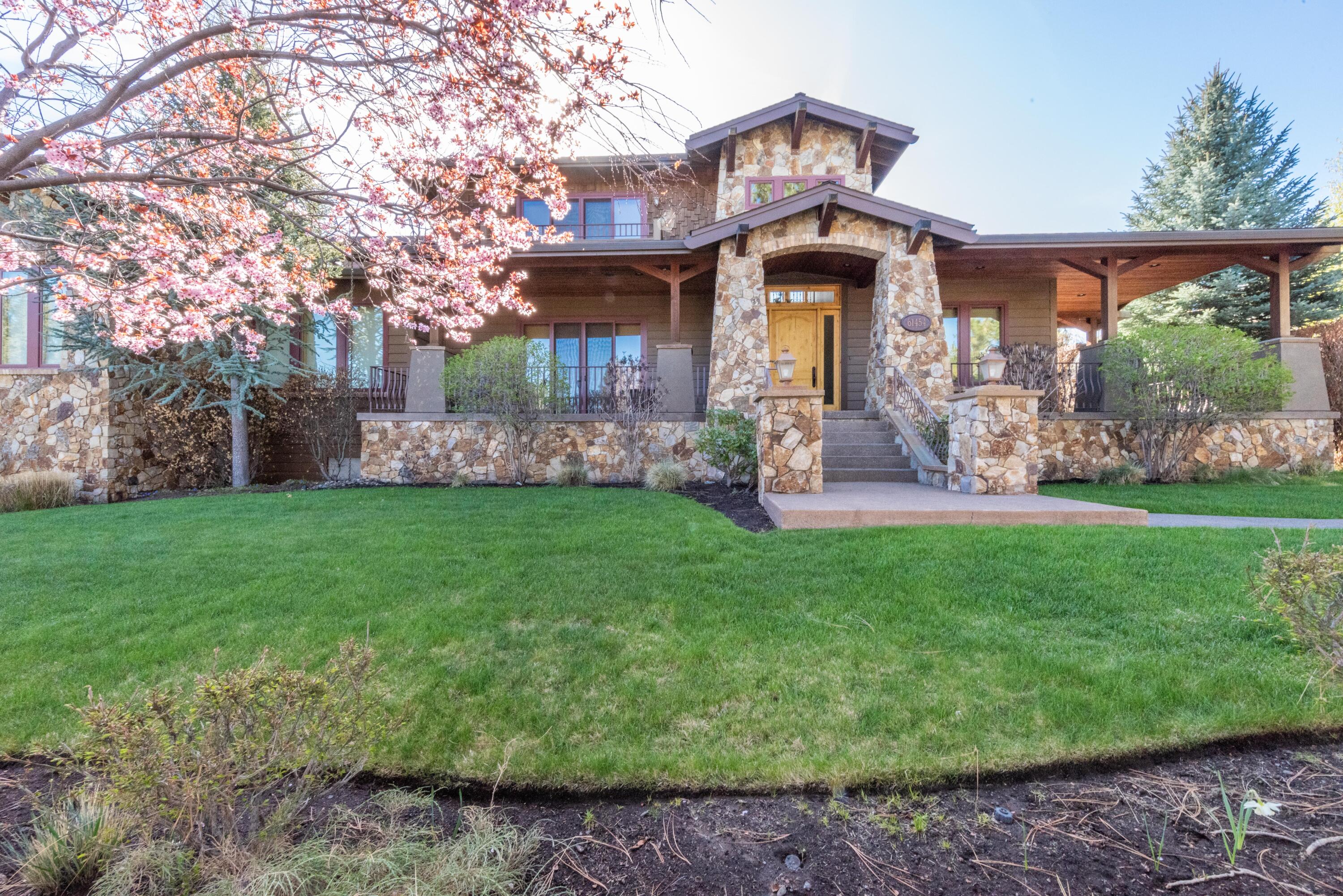 This timeless custom home offers equal parts refinement and comfort, livability and accessibility. Perched on a .65 acre lot within The Parks, this neighborhood is highly coveted for its green spaces, pool, sport court, proximity to trails, in-town amenities, and so much more. Here, distinguishing features reflect in the abundant windows, seamless connection to outdoor spaces, and rustic warmth from the stone detail creating an exquisite focal point. Intentionally designed for entertaining, the spacious Chef's kitchen with double islands centers at the heart of the home, wi outdoor access to a large private exterior patio with stone fireplace and yard beyond. Offering versatility and privacy, find the primary bedroom and full guest suite on first floor, and three additional bedrooms with jack & jill baths upstairs, as well as a 600 SF ADU over the detached oversized garage. A truly unique opportunity delivering a lifestyle of relaxation and recreation. Seller carry terms available.