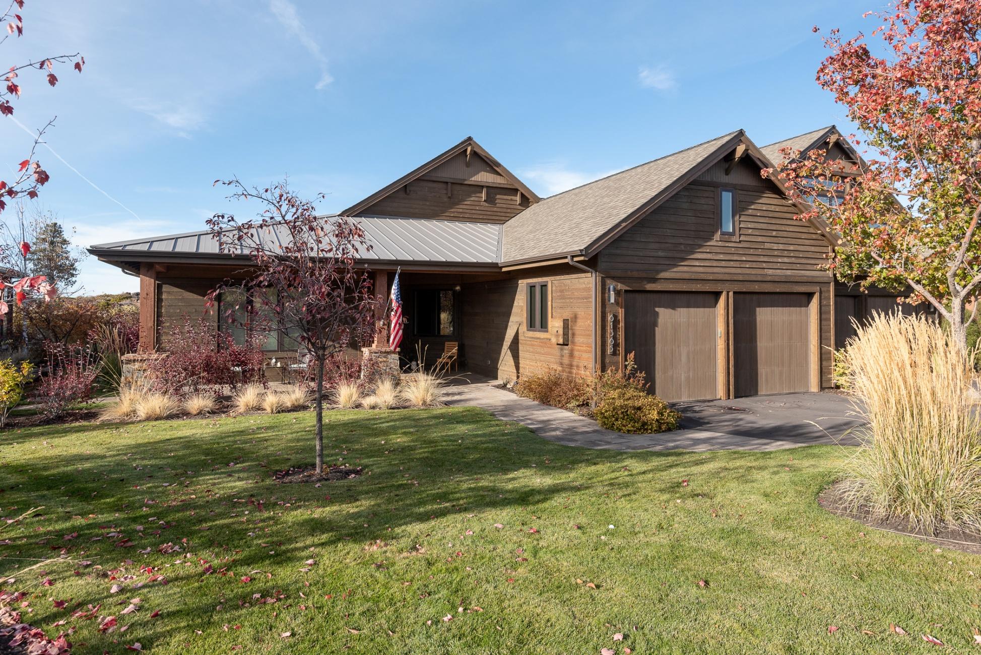 Gorgeous Tripleknot Townhome located within Tetherow, Bend's most desirable golf community. This beautifully upgraded single level home has nice separation of master and guest suites. Chef's kitchen with top of the line appliances, gorgeous cabinetry and a wet bar with wine fridge. The large island is
perfect for entertaining or multiple cooks. Floor to ceiling windows allow tons of natural light to fill the space. Incredible golf course and Cascade mountain views
will take your breath away. The great room has beautiful beam detail with vaulted ceilings. Hardwood floors throughout, spacious office with built ins. Oversized
paver patio with pergola overlooking the golf course with stunning mountain views. Indoor and outdoor natural gas fireplaces add nice ambiance. Gorgeous custom water feature. Oversized 2 car garage with custom built in cabinetry. Many more extras including central vac, radiant floors in master bath, plus so much more!