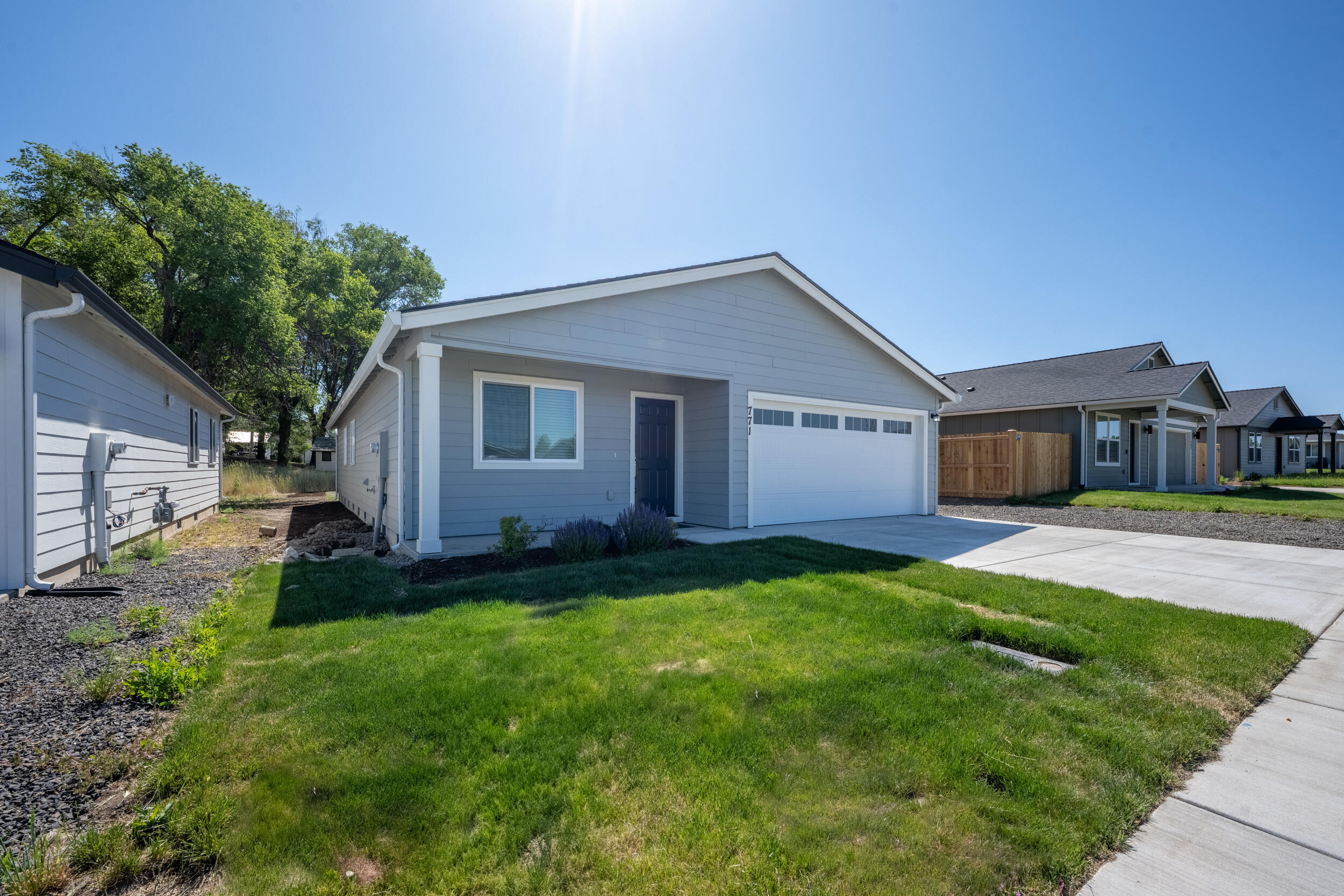 Come and tour this brand-new, move-in-ready home at Sagebrook Estates. 
The single-level, 1527-square-foot home features four bedrooms. 
The open-concept floor plan comfortably combines the kitchen, dining, and family room, making it pleasant for everyday living. The first two bedrooms are off the entry, with the third on the other side. The primary owner's suite is separated from the other bedrooms at the back of the home and features a walk-in closet and en-suite bathroom. 
The Kitchen has quartz countertops, sleek shaker-style cabinets, and stainless steel appliances. Additional features include central air conditioning, a tankless water heater, blinds, a refrigerator, a washer, and a dryer, all included with the purchase. Front and back yards are completed with grass and drip irrigation. There is a bonus flat gravel parking space alongside the concrete front driveway.