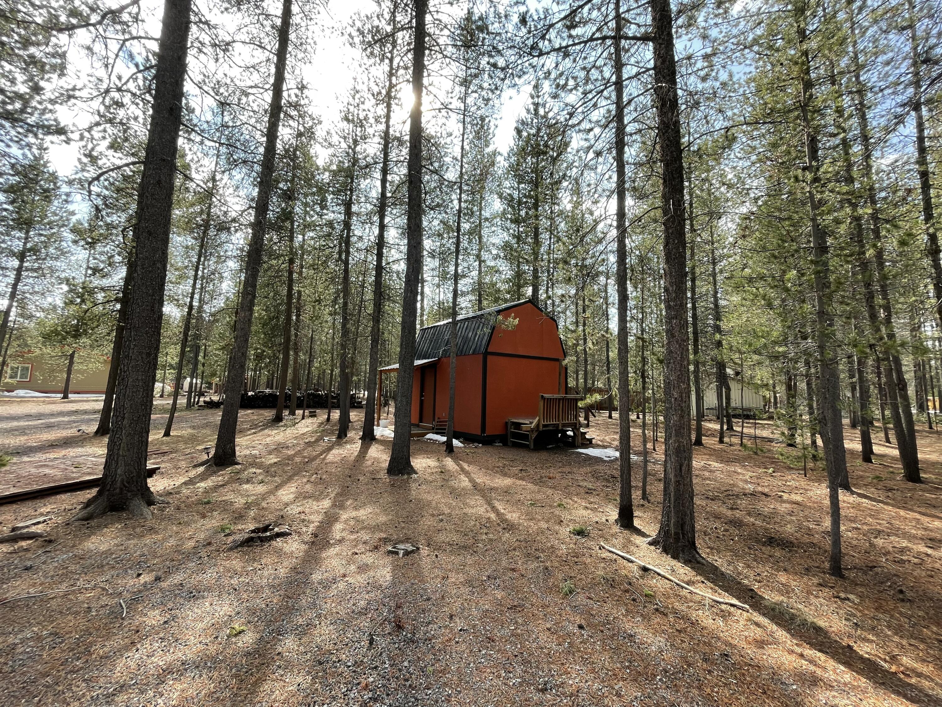 Beautifully manicured 1.05-acre parcel that's fully fenced and gated for privacy. This level, buildable lot sits among mature pines with natural landscaping and a quiet setting. A private well and on-site electricity support future development, with two storage sheds for equipment and generous space for RVs, boats, or a future shop. Minutes from downtown La Pine and close to La Pine State Park, the Deschutes River corridor, and Deschutes National Forest. Convenient access to recreation areas leading toward the Cascade Lakes, offering year-round opportunities for hiking, boating, fishing, and winter sports. Loan option available with 10% down, call for details.