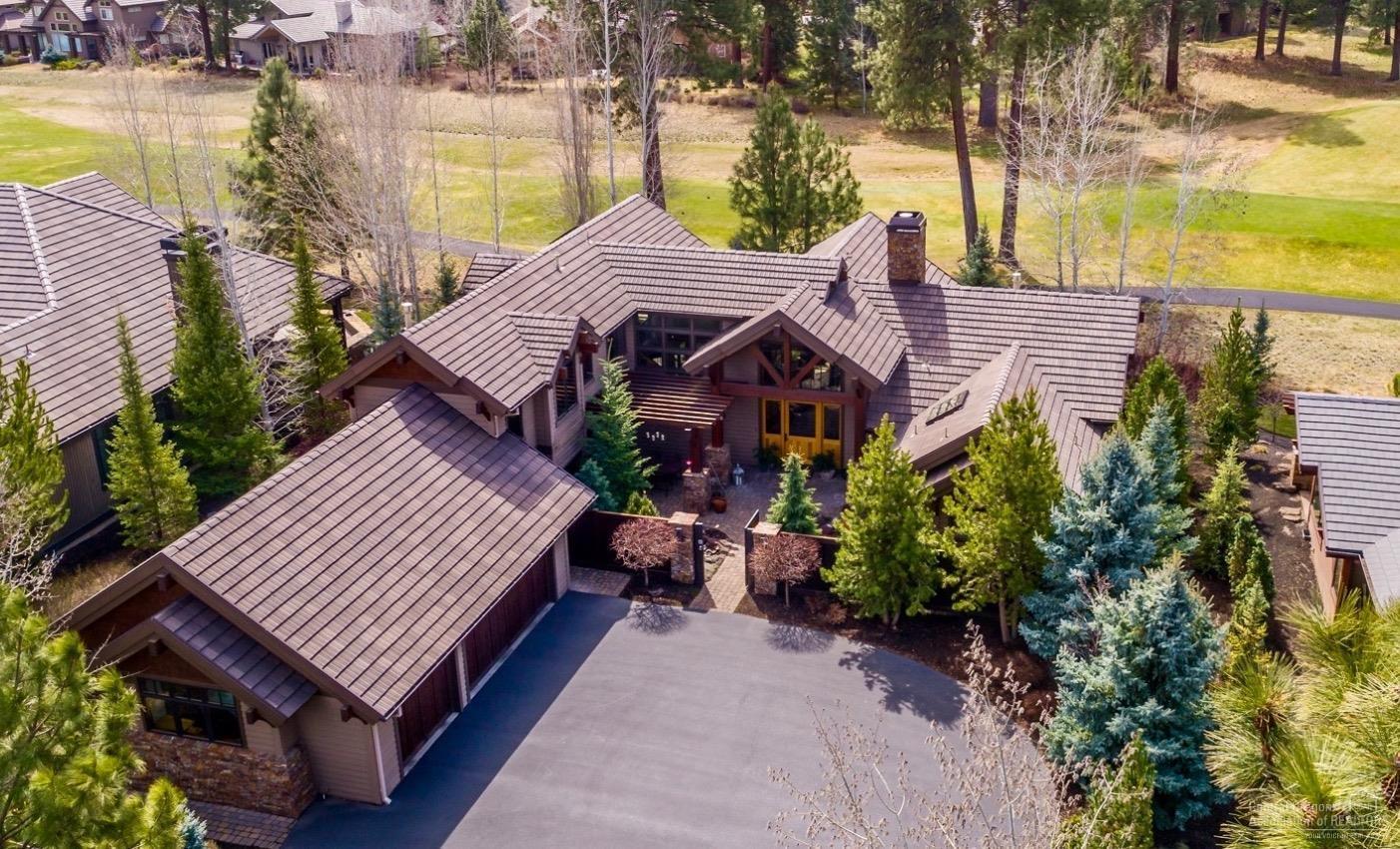SIMPLY EXQUISITE! Located in desirable Broken Top this Norman Building & Design custom home exemplifies the finest in architectural design & exceptional craftsmanship. Warm, well appointed & thoughtfully designed w/master suite, ensuite guest room, office on main level, 2 bedroom suites & loft upstairs. Enjoy the outdoor living spaces, private courtyard w/water feature & covered back patio for relaxing & entertaining. On a large lot nestled among Ponderosa Pines w/ stunning views of the 17th green!