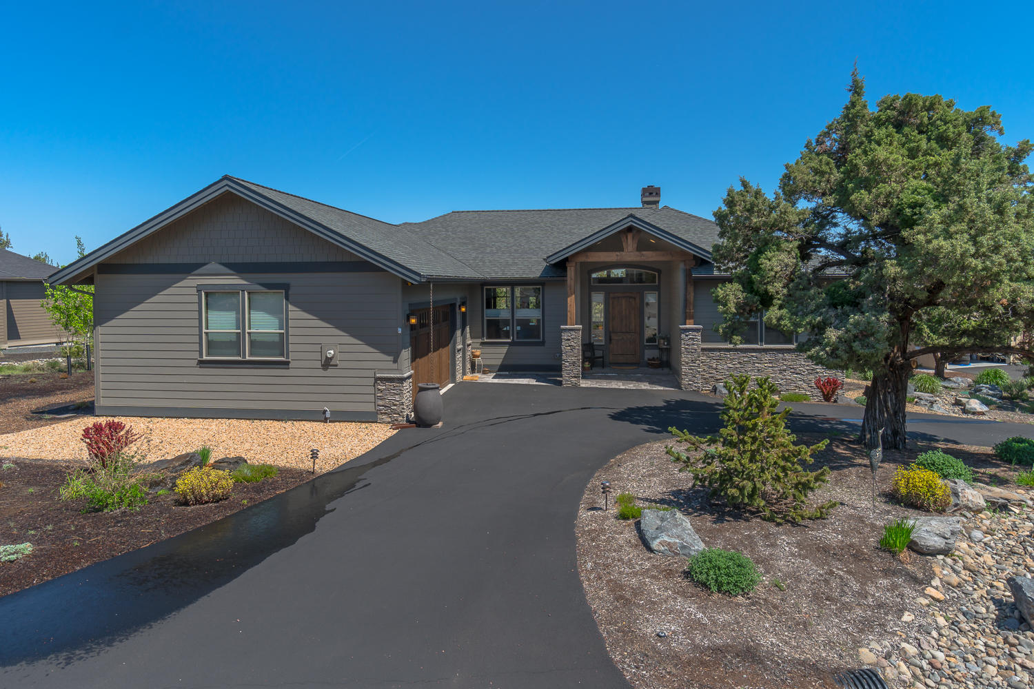 Spectacular custom built one-level home with soaring ceilings and stunning views of Smith Rock. The open concept great room includes a chef's kitchen with island, breakfast bar, and top of the line appliances. The dining area comes complete with a built in wine bar. The Master bedroom suite is  privately situated on one side of the great room and the spa-like guest rooms are on the opposite side. Enjoy miles of High Desert views from the massive hot tub on the expansive deck which is perfect for quiet reflection or entertaining a crowd. Enjoy all the amenities Eagle Crest has to offer, including 3 18-hole golf courses, miles of hiking and biking trails, multiple pools, tennis and pickleball courts. Come home to Eagle Crest!