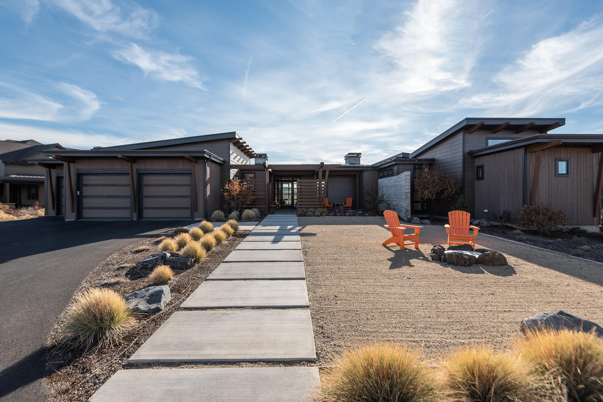 Take in breathtaking mountain views from this extraordinary, single level contemporary home situated on a .87 acre lot. This custom built home features ample natural light, exposed beams, wood burning fireplace, metal roof, split oak cabinets and beautiful hand scraped white oak floors plus so much more! 3 bedrooms all with en suites, plus a spacious office located in the main home, detached casita with full bathroom makes this home an excellent option for so many types of households. The outdoor space between the home and casita offers a crushed granite approach with a gas fire pit making it a fun outdoor entertaining space for corn hole or bocce ball . Through the la cantina style doors out back you'll find multiple seating areas, outdoor gas fireplace and low maintenance landscaping. Located in Tartan Druim, a private, gated cul-de-sac community within Tetherow bordering The Deschutes National Forest. Come be a part of this highly sought after community