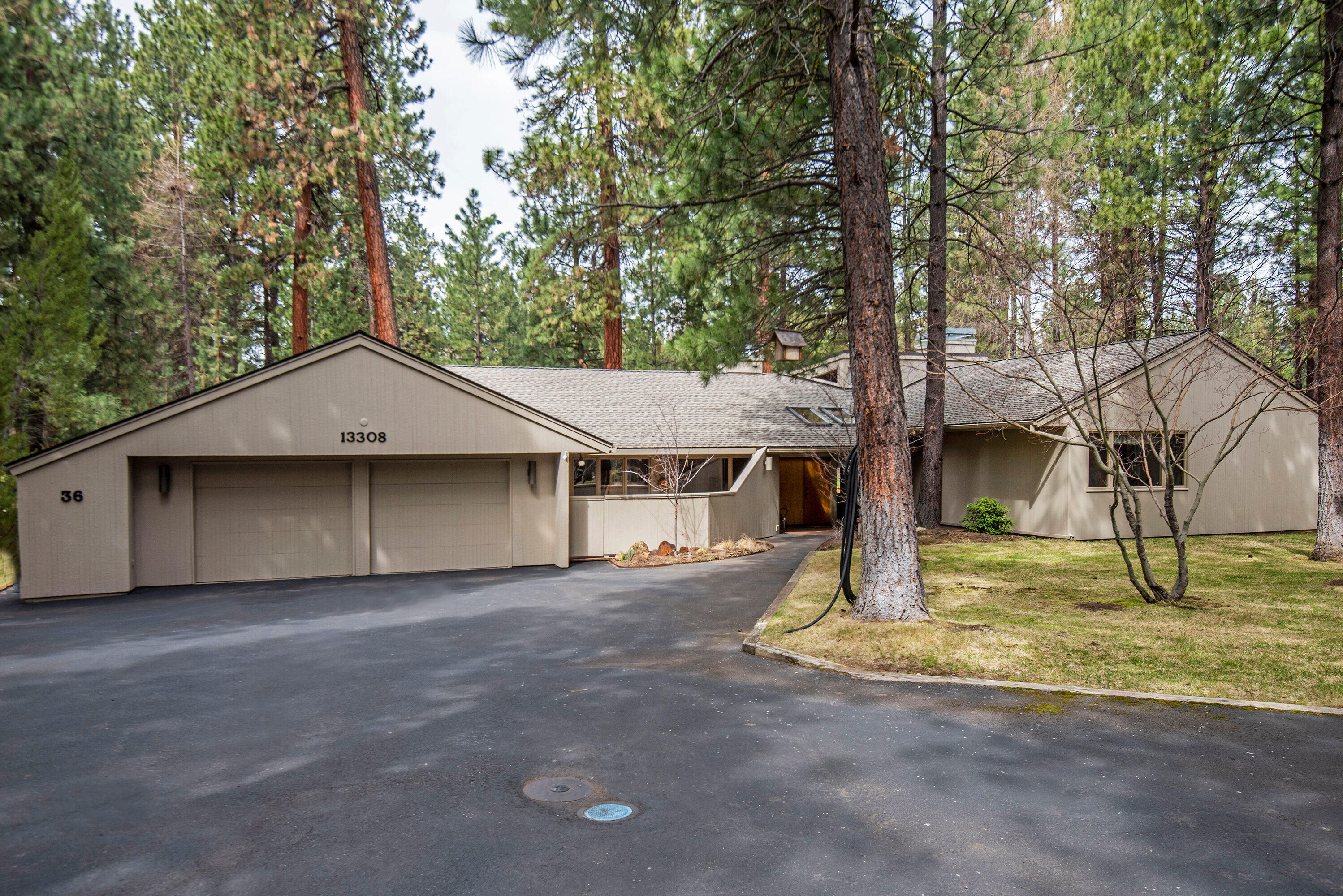 Exceptional single level home with open floor plan that overlooks the 2nd fairway and green of the Big Meadow Golf Course. Access from great room to large deck for entertaining with golf course and Black Butte views. Home features two ensuite bedrooms in separate wings. One wing has three step entry into private, extra spacious ensuite with large walk in closet. The other wing has second ensuite, two bedrooms, and a bathroom. Roomy laundry room with sink, views enclosed front patio. Garage features work bench with ample space for your tools and toys. This Van Sant designed home is ideal for multi family use. Close to Robert's Pub, Big Meadow Golf Course, driving range, disc golf, the lodge complex with swimming, hot tub, work out facility, Lake Side Bistro, fly fishing on Phalarope Lake, and more.
