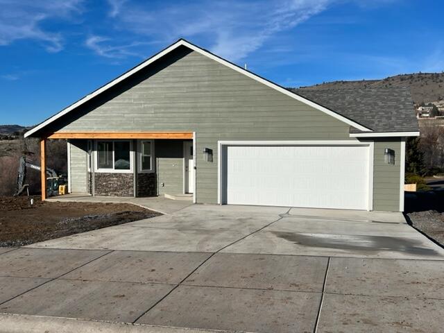 New construction located in a newer subdivision! Featuring an open floor plan with 3 bedrooms, 2 bathrooms, and 1804 sq.ft. The kitchen includes custom wood cabinets, granite counters and walk-in pantry. Large laundry room and some vaulted ceilings. Nice primary suite with walk-in closet and double sink vanity in the ensuite bath. Engineered hardwood floors, tile and carpet throughout with gas forced air heat and AC. Covered back deck with views of Hogs Back.