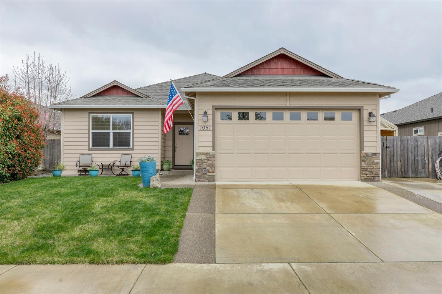 Attractive single-level home with RV parking in fantastic NW Medford neighborhood! Vaulted, open floor plan. Kitchen offers granite counters, eating bar, refrigerator, smooth cooktop range/oven, microwave hood and pantry closet. Handsome engineered wood flooring throughout entry, hall, kitchen and dining. Ceiling fan in great room. Vaulted master bedroom has door to back patio. Master bathroom has tile floor, double sink granite vanity and walk-in closet. Guest bathroom has granite vanity, linen storage and tile floor. Extra cabinet storage and tile floor in laundry room. Covered back patio plus garden shed - detached workshop. Nicely maintained inside and out!