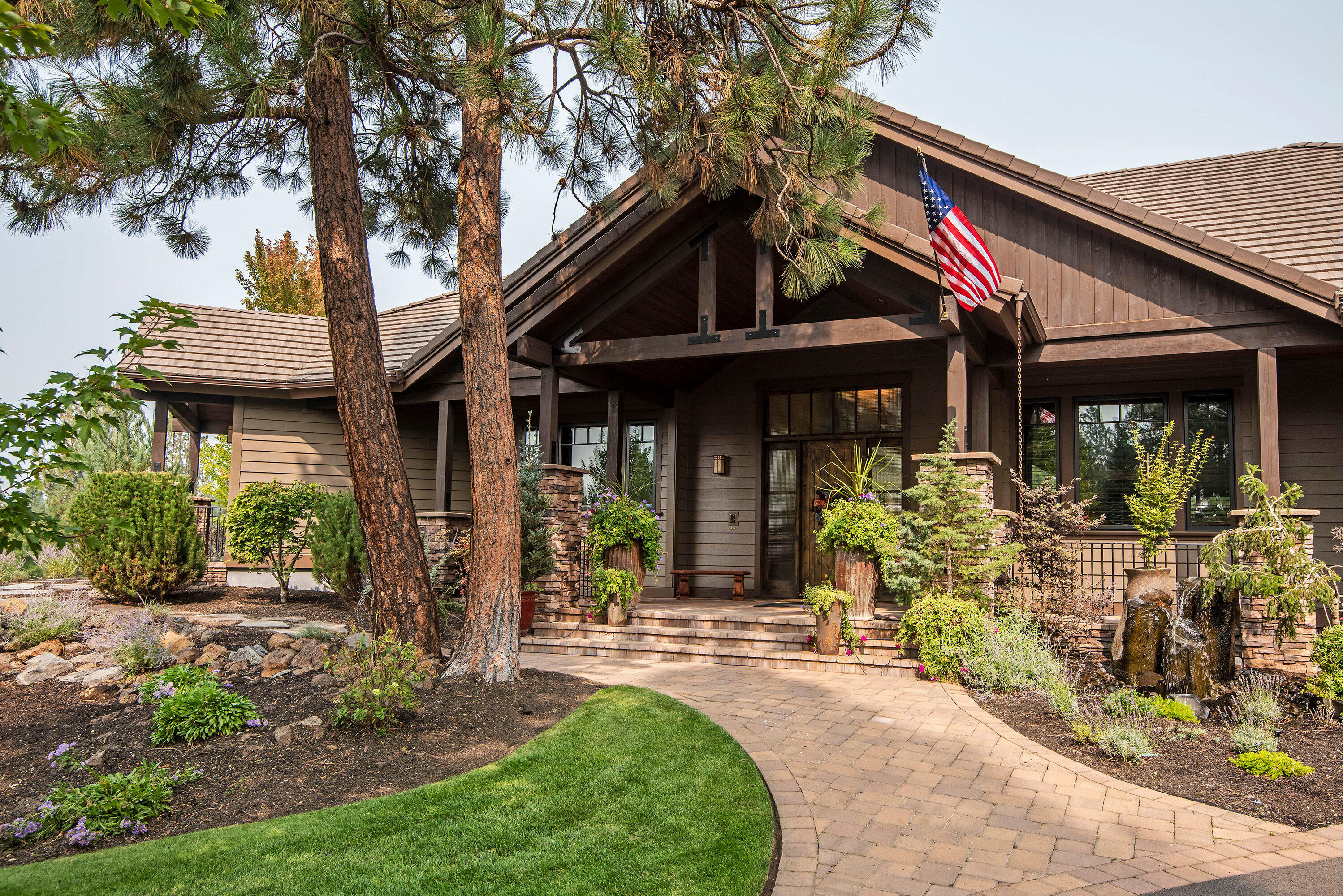 Beautiful home for entertaining, on slightly over an acre lot, overlooking the 11th green at Lost Tracks.  Grand entry, open beam vaults, through the great room, to three level deck, magnificent water feature with multiple falls, fire pit, golf course and mountain views. Hickory floors, knotty alder doors, cabinets and trim, slate, granite, wood clad windows, and four fireplaces. Gourmet kitchen, Decor appliances, large island, two sinks, warming drawer, double oven with beautiful views, formal dining room, corner fireplace, could accommodate a large gathering. Executive office with built-ins, delightful master suite, double sided fireplace, large soaking tub, heated floors, dual vanities, and a large walk-in closet. Main level living with 3 car garage, step up to the Cascade Theater and a bonus room perfect for sleep overs. this well appointed home has every detail & would be perfect for anyone who appreciates quality! Shown by appointment only.