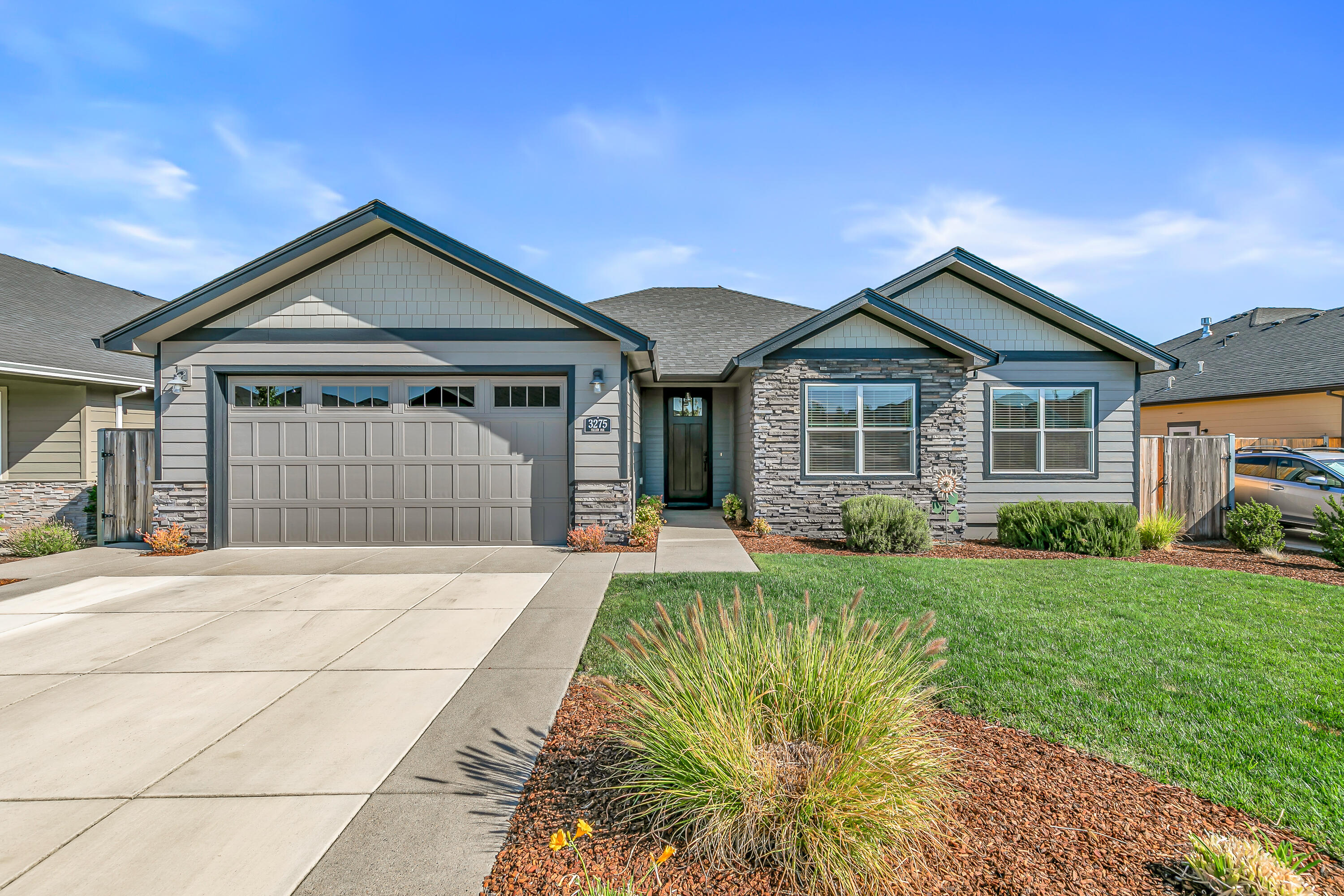 This home is more than just a place to live; it's an opportunity to embrace a vibrant lifestyle within a community that prioritizes green spaces & outdoor recreation. Cedar Landing offers miles of trails & open spaces, inviting residents to  exercise & connect w/nature. Be the newest owner this pinnacle of modern living in a desirable location. Step inside& prepare to be wowed by the 10-ft ceilings, giving it an open & airy vibe. The master suite & 2nd bedroom also have vaulted ceilings, really adding to that luxurious feel. Gorgeous granite countertops throughout the home, even on the large kitchen island, perfect for entertaining or grabbing a snack. The beautiful flooring is super durable LVP in all the main areas & tasteful tile in the wet spots. The private suite is a sanctuary, w/a custom-designed spa feel shower. The walk-in closet gives space for all your clothes! Outside, this home charms w/a covered deck-ideal for coffee or unwinding. Large backyard for outdoor activities.
