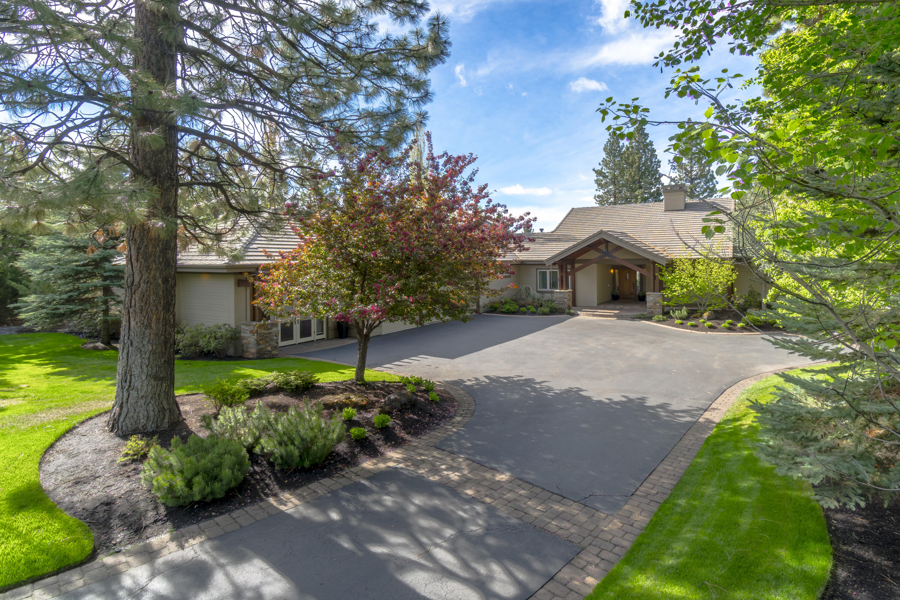 Premier single-level home in Broken Top on a level, south-facing 1/2-acre lot situated on the 17th fairway. Golf course views featuring pond, ponderosa pines, and southern hills. Beautifully renovated throughout creating an up-to-date, clean and bright feel with designer touches. 3BR/3BA in the main house, with rare, private separate entry suite including office, bedroom and bath. Perfect for working at home or a guest suite. The main living area has hickory hardwood floors, vaulted ceilings and huge windows facing some of the best views in Broken Top. Bar seating, stainless steel appliances, beverage fridge, dual zone wine fridge, ice maker and dining room are all ideal for entertaining. Wonderful skylights, 3 gas fireplaces, large patio, deck and lawns. The master suite is on its own wing with a huge walk-in closet and French doors opening to the patio and hot tub. Oversized 1,190 sq ft 3-car garage with enclosed storage room and custom-built cabinets.
