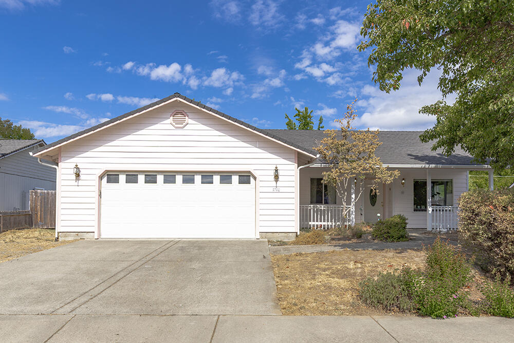 Welcome to 1710 Blue Moon Ln, a charming 3 bed, 2 bath home nestled on a quiet cul-de-sac in Grants Pass. This 1,448 sq ft residence offers both comfort and function with vaulted ceilings, skylights, and an open layout filled with natural light. The kitchen is well appointed with granite counters, a pantry, and plenty of workspace for the home chef. Relax on the covered front porch or enjoy outdoor living on the two covered back patios overlooking the large, fully fenced yard—perfect for entertaining, gardening, or pets. There's also space to store a small RV or boat, adding to the home's versatility. With a .19-acre lot and thoughtful design, this property blends style, convenience, and practicality in a highly desirable location.