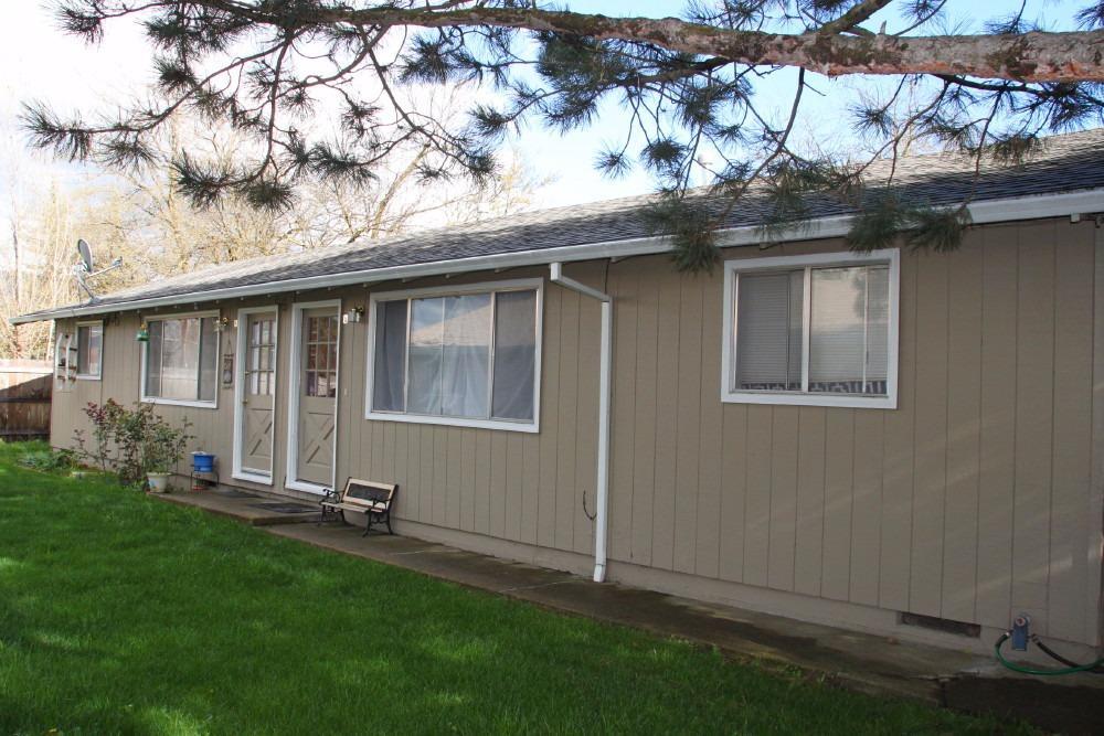Great opportunity to own a duplex in Phoenix. Centrally located between Medford and Ashland. Each unit is 2 bedroom 1 bath. There is a separate 2 car garage shared between tenants with separate washer and dryer hookups. New roof in 2009, gutters,forced gas air and many other upgrades. Seller pays water/sewer and garbage. Tenants are established and would like to remain. Please do not disturb tenants, appointments required.