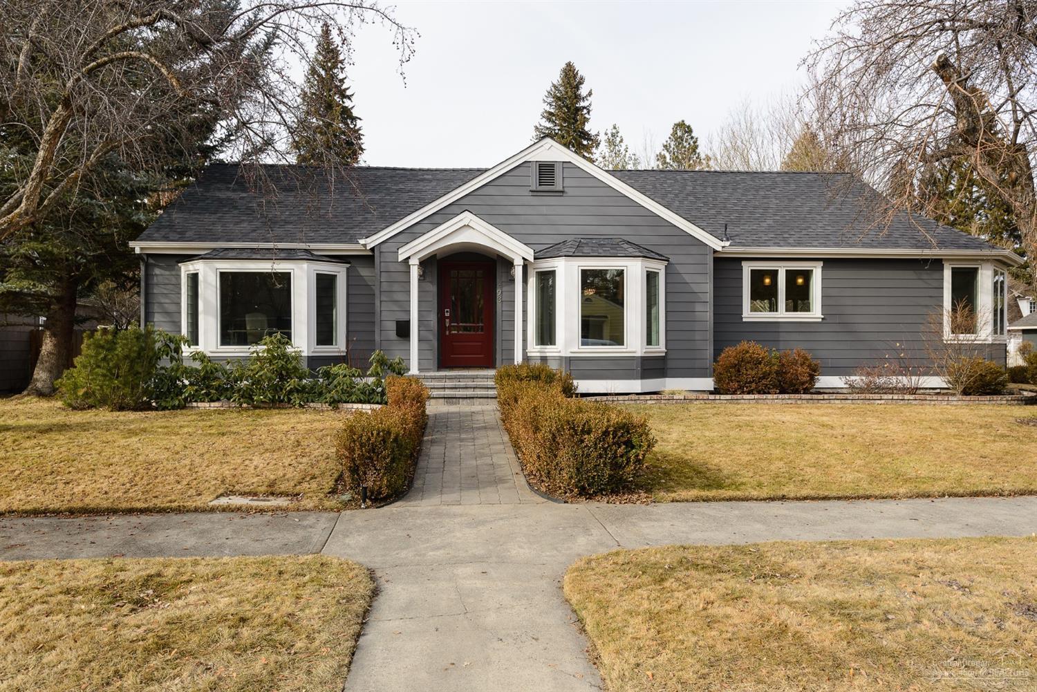 Perfectly placed in the historic district in downtown Bend, this completely remodeled home has it all. All 4 bedrooms & the beautiful office/ music room are on the main level, with a large bonus room and full bath below. Danby marble graces the gorgeous kitchen, with built-in Miele coffee machine and Wolf range adding to the luxury. The great room looks out to the fenced yard with hot tub and river views. The master bath is your very own spa with a marble steam shower, hand-painted tile and a soaking tub. Every single room in this home has been remodeled, as well as a new roof, furnace, central vac & much more. Elevate your life with the convenience of walking to Drake Park, downtown, the Old Mill, and trails.