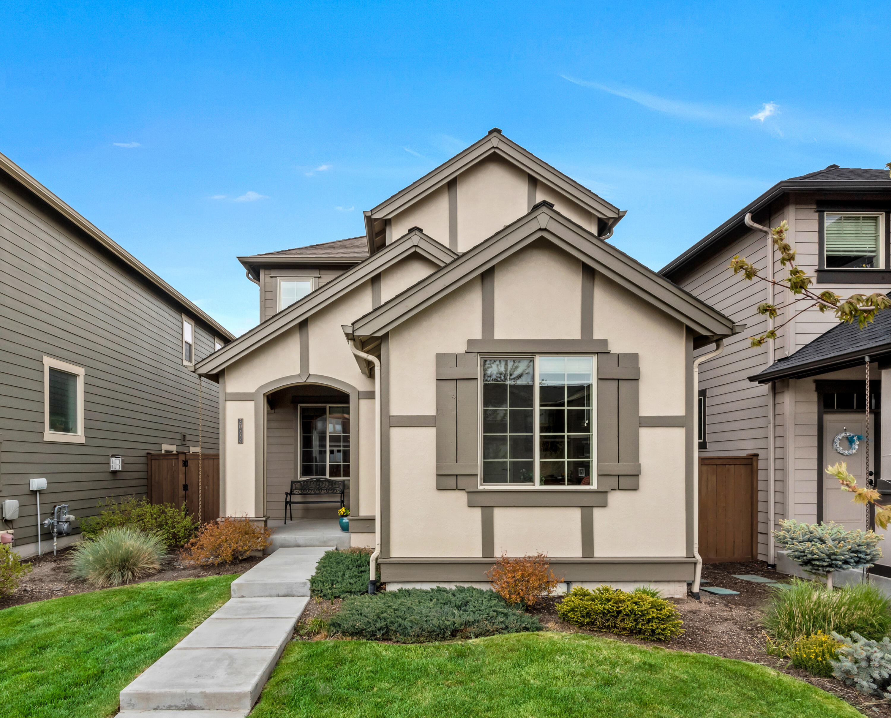 Better than new, quality built Pahlisch home in the highly desirable McCall Landing neighborhood in NE Bend. Conveniently located on a quiet street with recreation and parks nearby including Boyd Park and Pine Nursery Park. Many upgrades throughout including AC, ceiling fans, window coverings, April Air system, and an enlarged paver patio. The ever popular Colton plan has 3 bedrooms, 2.5 baths, a den/office on the main level, and a bonus room upstairs for additional flexibility and living space. Spacious master suite with room for your king bed, nightstands, dressers and armoires, not to mention the large walk in closet. Appreciate the quality finishes with stainless steel appliances, quartz countertops, under counter lighting, gas fireplace and wood laminate flooring. No need for a lawnmower, the front yard landscaping is maintained by the HOA. Make your appointment today, you will not be disappointed!