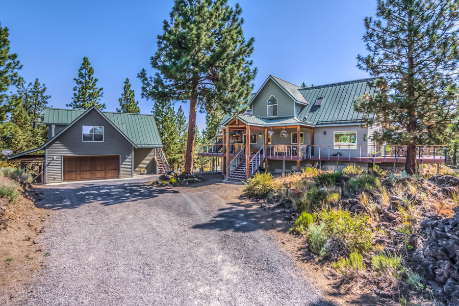 Amazing property - private, end of road, irrigation, tall trees, horse set up, shop, beautiful home w/separate guest quarters & adorable pond-side cabin w/large deck. Borders Nat'l Forest Land. Main home is 3 bdrm, 2 bath with a vaulted, open living area allowing lots of natural light & great views. Loft office overlooks living space w/master bedroom off one side. Two bdrms have private deck/balcony to enjoy the serene surroundings. Basemt is 3rd bdrm or bonus area. Garage includes heated floor, insulated finish, indoor/outdoor dog kennel, finished guest space upstairs w/a private balcony. Property features 37.5 ac irrg, 13 acre hay field, cross fenced pastures w/shelters & undergrnd sprinklers. 40x40 horse barn w/3 stalls, hot & cold water, tack room & hay storage space. Horse stalls open to outside paddock w/water and electric. 48x48 shop is open, insulated, 220 v in workshop for welder, air plumbed along wall, storage closet & loft area along w/finished office & hot/cold water.