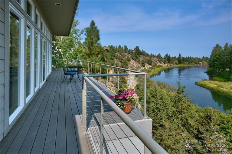 Outstanding panoramic views of the Deschutes River from every room. This home has it all with direct access to the Deschutes River Trail just 1 mile from downtown! Spacious open-plan living/dining, media room, and chef's kitchen with granite countertops and high-end appliances. Enjoy the views, an active lifestyle and your own slice of paradise from 2 master BR and 2 large balconies. A study serves as a potential 3rd bedroom with ideal bedroom separation.