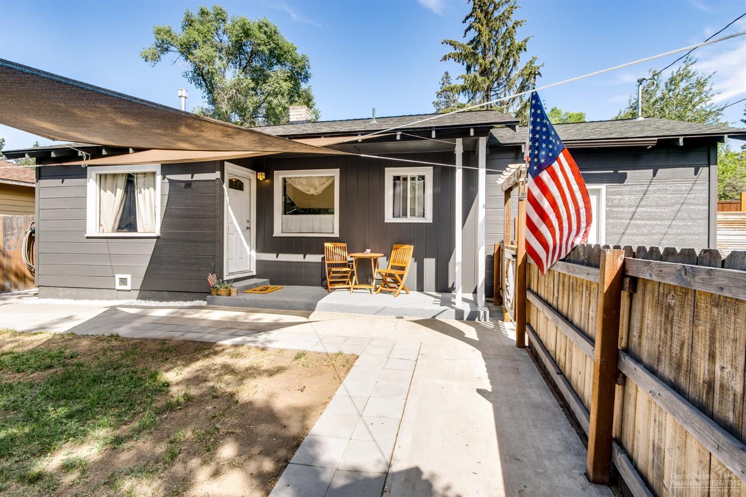 Charming remodeled cottage in desirable mid town district, right in the heart of Bend. This little gem is 1/2 mile from the Pilot Butte Trail, 1 mile to downtown Bend, walking distance to shopping, schools and medical facilities. Vintage hardwood floor, tiled counter tops, tiled shower. Fully fenced yard with peekaboo mountain views from the front porch gives this home a private setting. Its the perfect location for the perfect price.