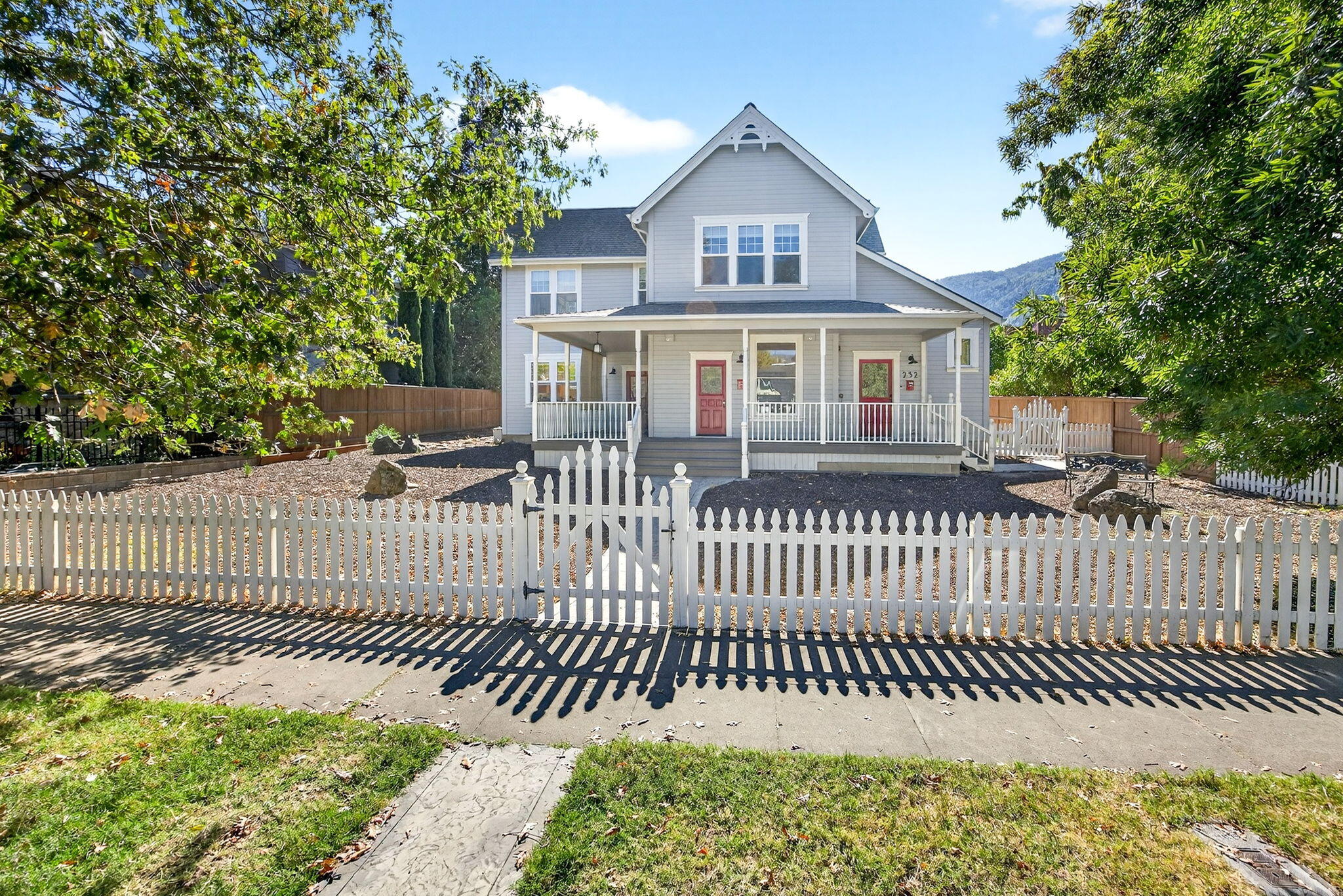 This beautiful Ashland triplex in the heart of the Railroad District, blocks from Food Co-op, theater and downtown, has a large .23 acre lot, plenty of parking and lovely historic curb appeal with modern amenities and upgrades. Currently owner-occupied, 254 has a large living area, a 2017 kitchen remodel, 2 bedrooms each with its own bath and laundry. 256 is a one bedroom w/ full kitchen, living area, bathroom and a patio with garden boxes. 252 is upstairs and was newly built in 2017. It is a permitted vacation rental with gorgeous high ceilings, large view windows, spacious kitchen, 2 beds, 2 baths and washer/dryer. Upgrades galore- tankless water heaters, new concrete pathway and parking for 4 cars, plus 1 RV & a sundeck.  Whether you seek an investment property or a primary residence w/ a multi-generational layout, this beautiful home is a must-see. Buyer to perform their own due diligence regarding permitted uses & future possibilities.