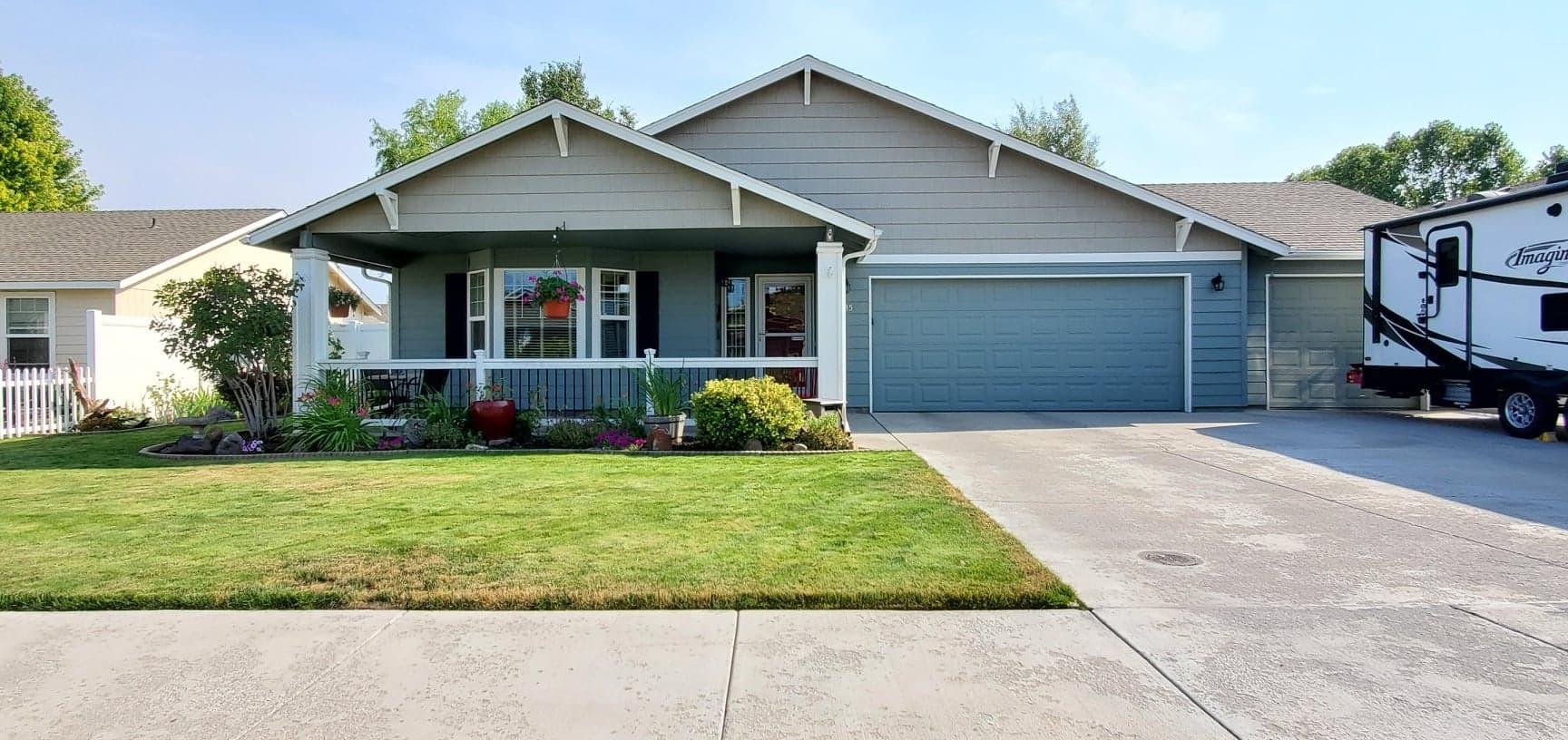 Beautifully landscaped and well cared for 3 bed, 2 bath home with 3 car garage. Stainless steel appliances, quartz countertops, tile backsplash in kitchen. High vaulted ceiling and lots of living space. RV parking available on side of driveway. 2 patios with awnings, sprinkler system, adorable garden shed and raised garden beds make a wonderful outdoor living area. This home is pristine and is really a must see!