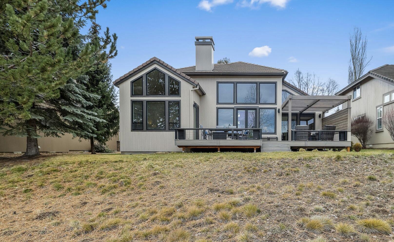 Stunning remodeled single level home with picturesque lake & golf course views in the desirable Broken Top golf community. Soaring ceilings & expansive windows bring the outdoors in, filling the home with natural light and creating an open and airy feel. Fresh, modern finishes throughout, from new stainless-steel appliances and quartz countertops to custom cabinetry, lighting and beautiful hardwood maple floors. Every detail thoughtfully selected. The well-designed floor plan offers a nice separation between the two guest rooms & the spacious primary suite, which features vaulted ceilings, radiant heated floor, 2 walk-in closets & a soaking tub. The new back deck complete with a pergola, offers quiet mornings to enjoy the scenery & a welcoming space for evening get-togethers. Enjoy the Club & restaurant, miles of tree-lined trails within Broken Top and optional memberships available to suit a variety of interests. An exceptional opportunity to live in a vibrant & welcoming community!